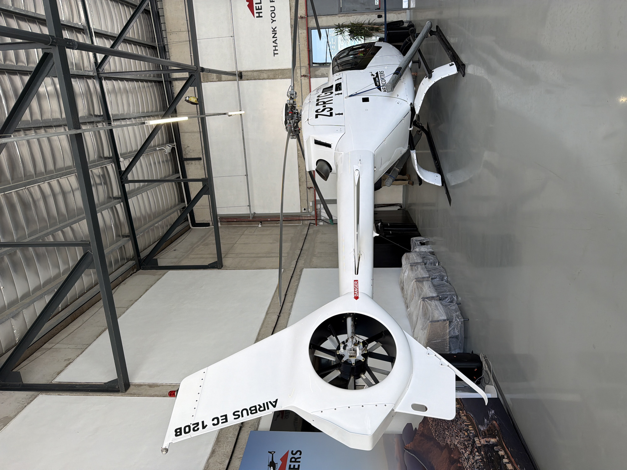 White helicopter spotted at Cape Town facility during maintenance operations