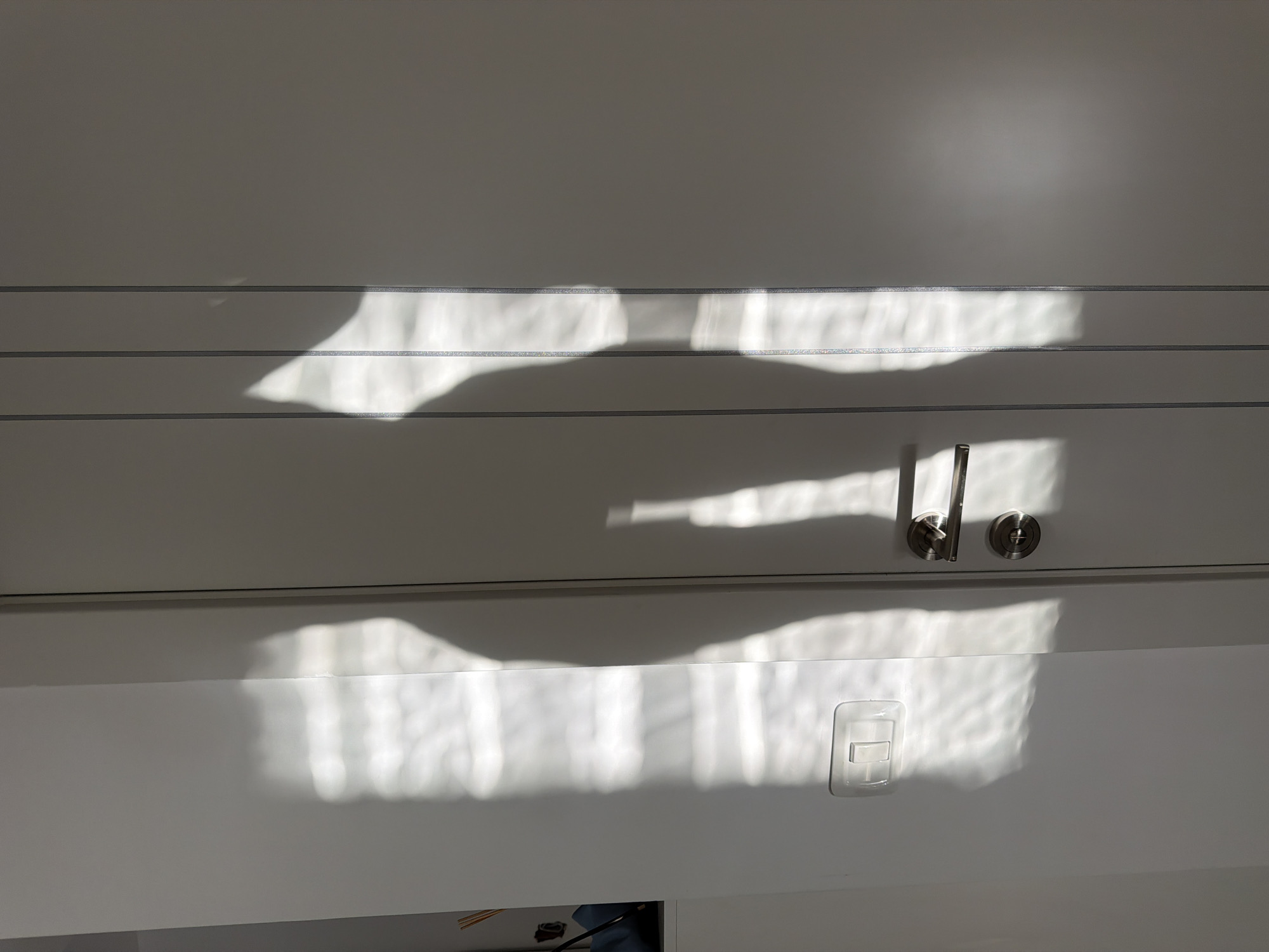 Morning light inside and outside a Bat Yam apartment