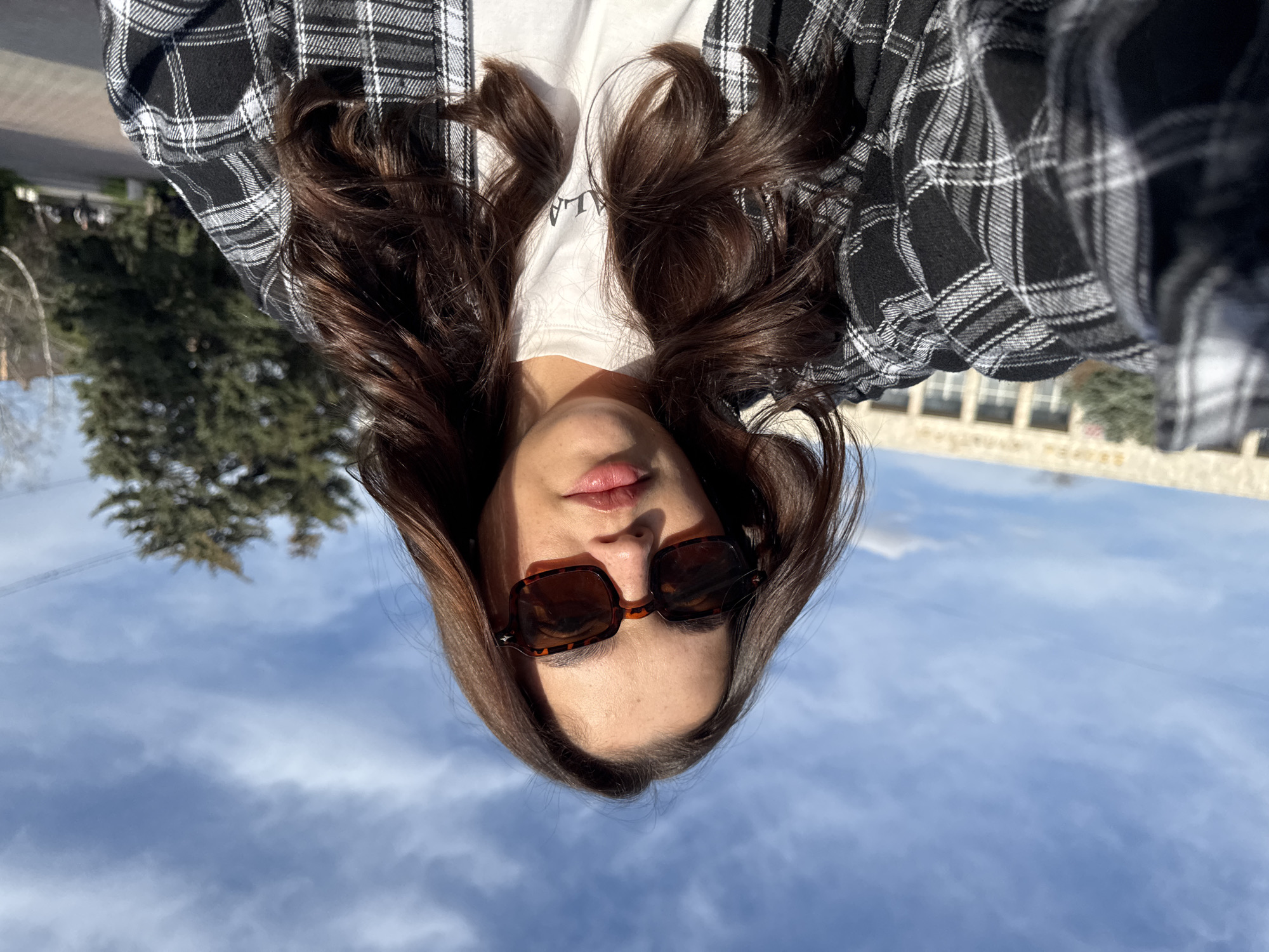 Woman takes selfies in public space in Bataysk