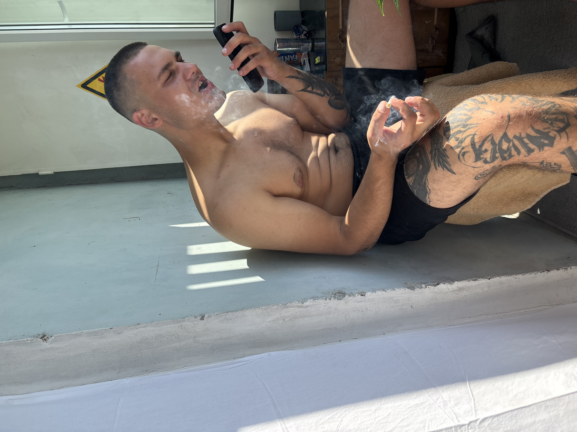 Indoor downtime in Pivdennoukrainsk, cannabis plant by the window