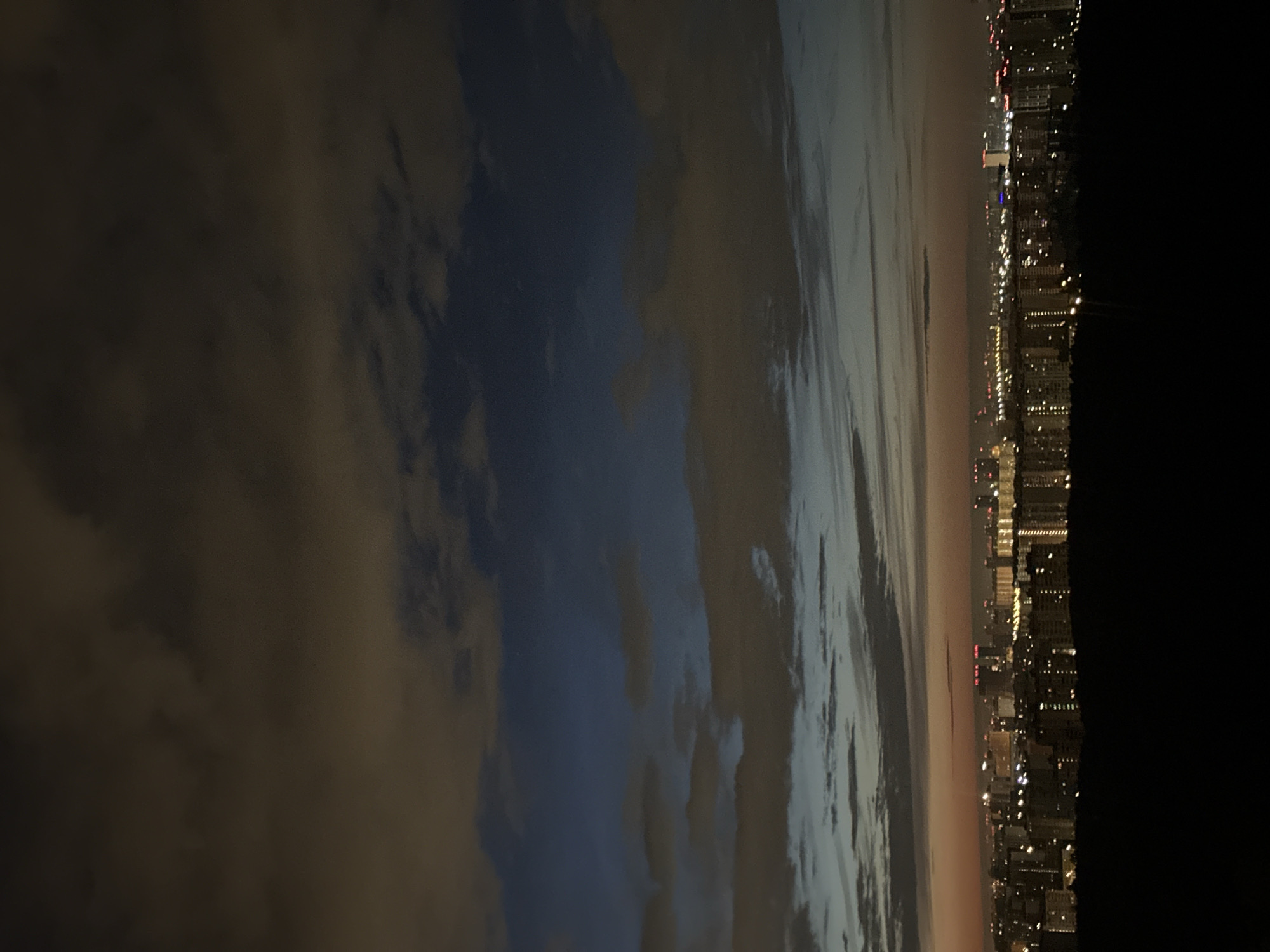Moscow skyline at night under a cloudy, streaked sky