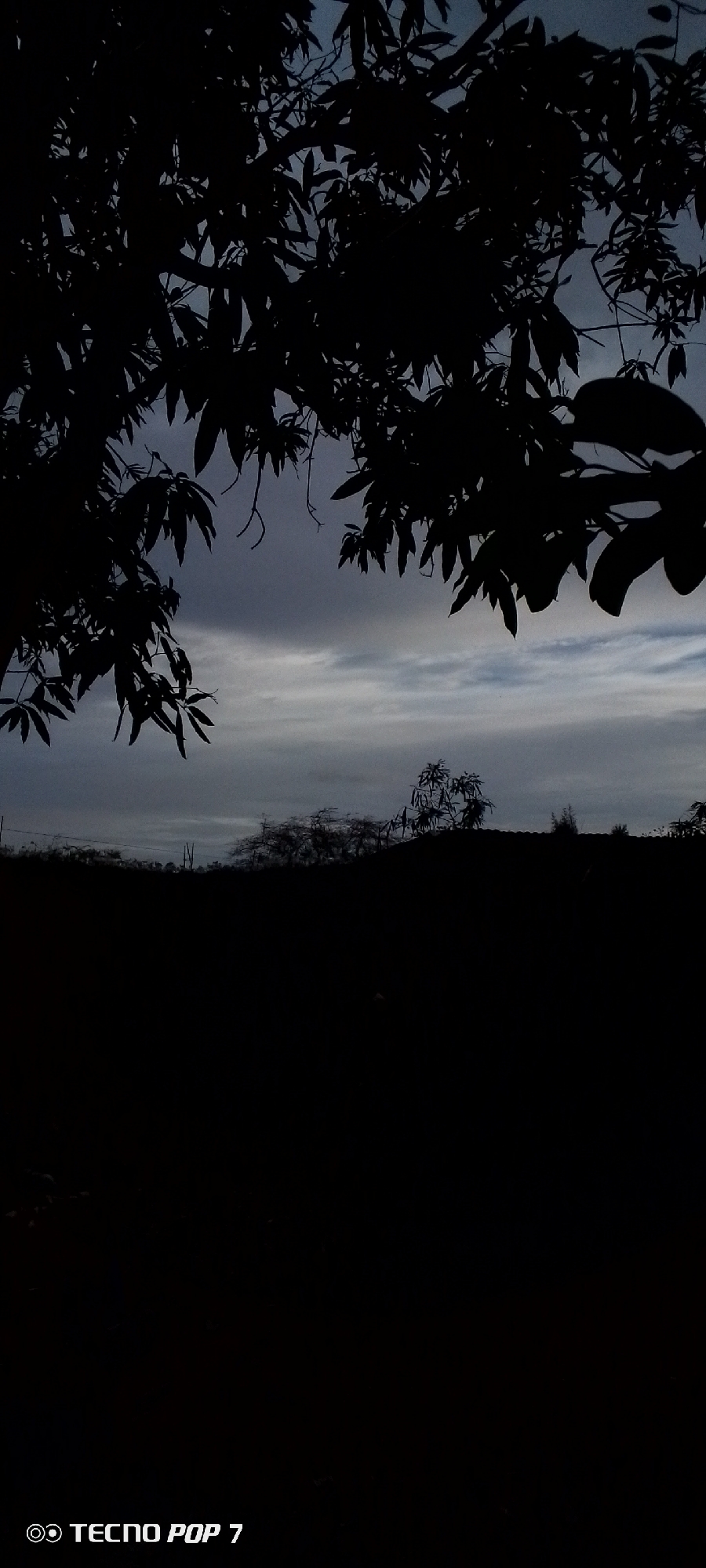Dusk settles over a quiet residential block in Altagracia