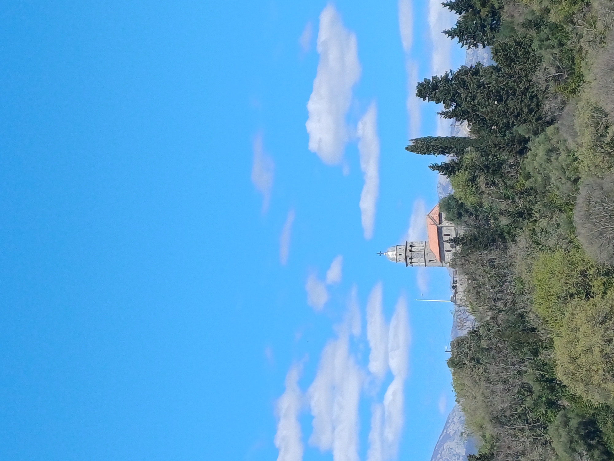 Church tower and balcony views captured in Gošići Montenegro