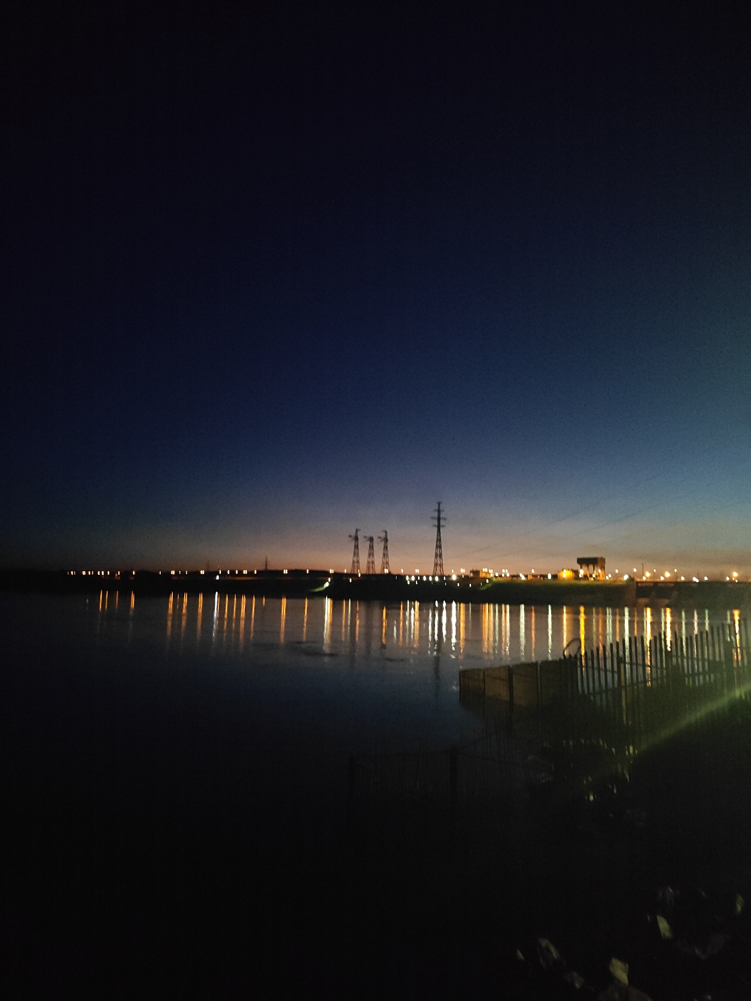 Evening waterfront scenes documented in Chaikovsky, Russia