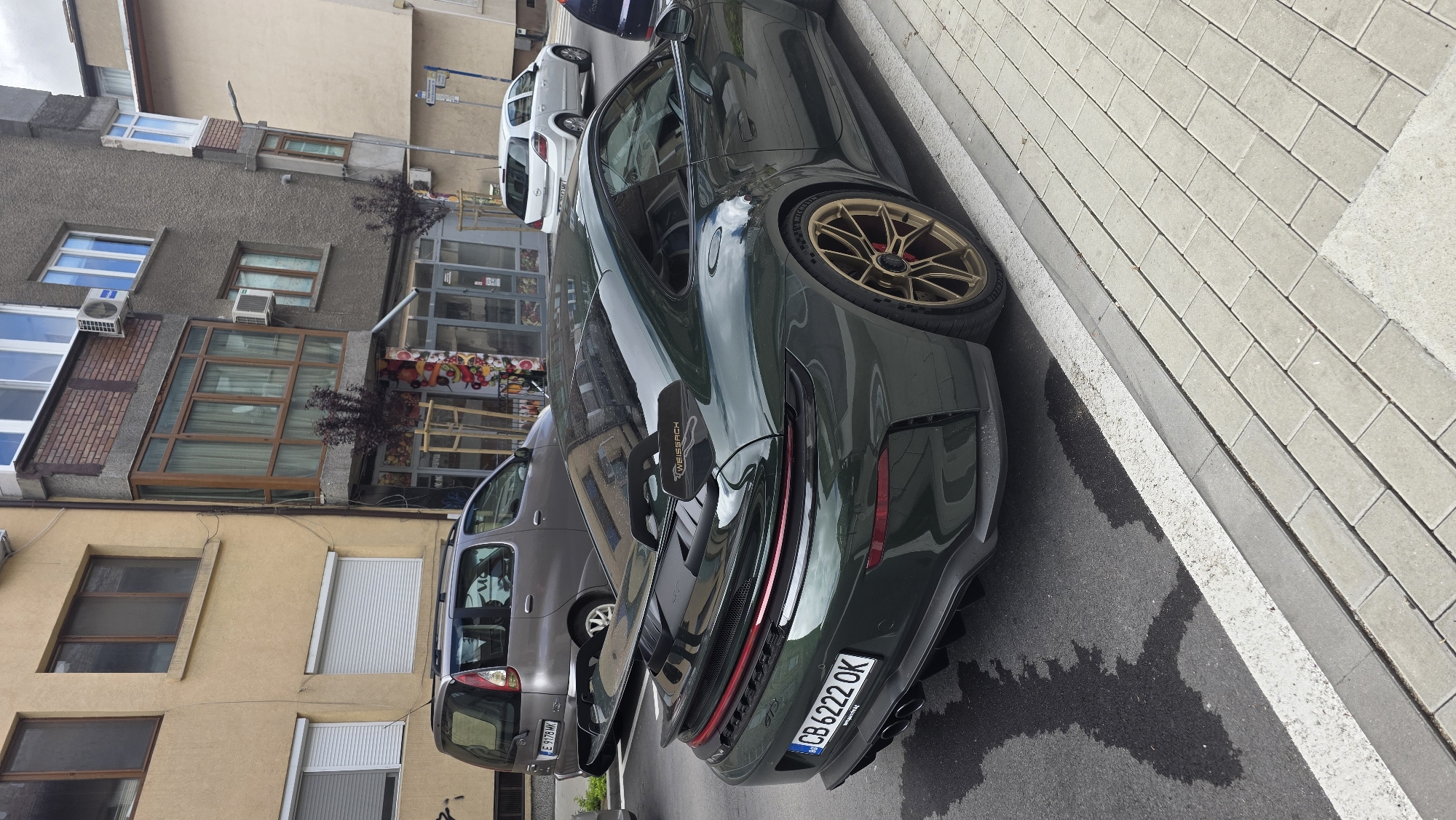 Morning documentation of green Porsche and street scenes in Blagoevgrad