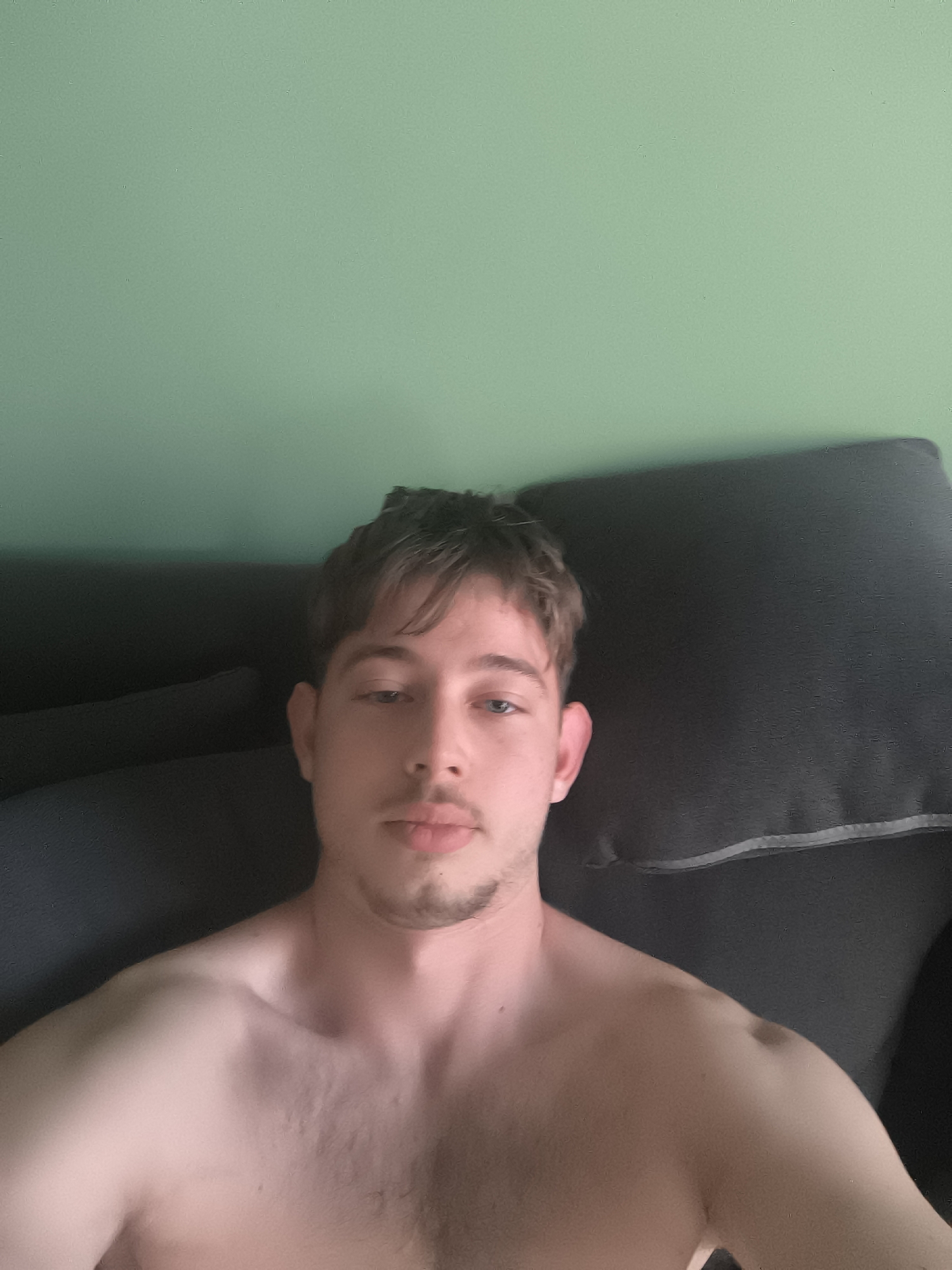 Young man takes selfies indoors in Sofia, Bulgaria