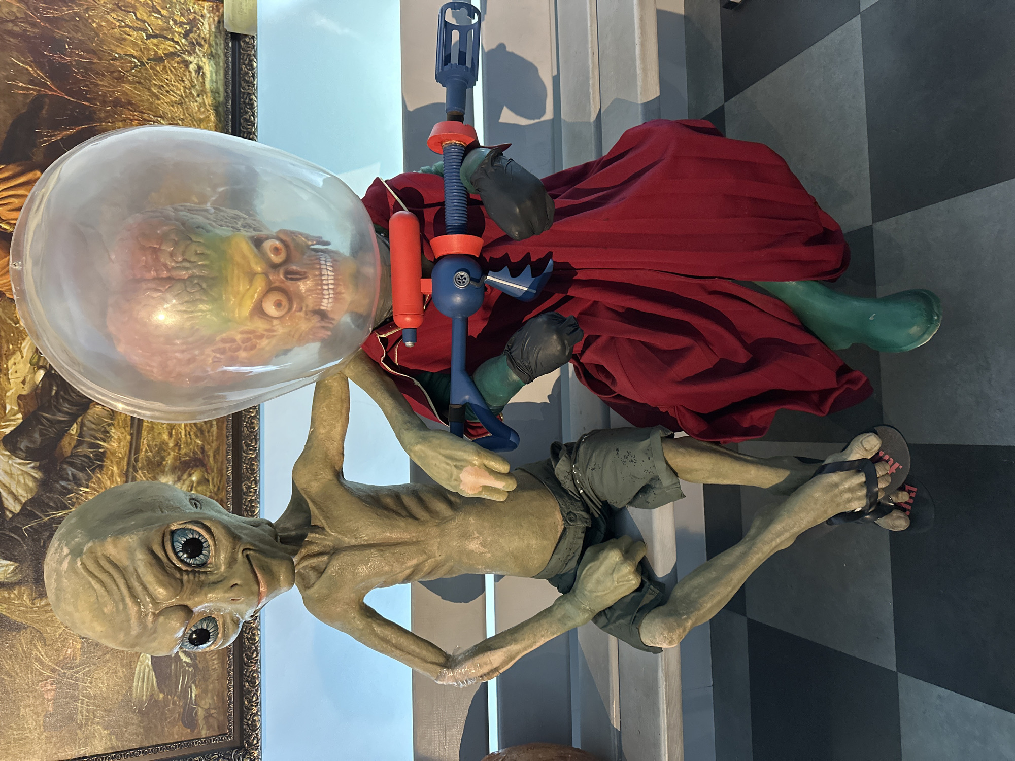 Creepy bench companions: alien figure and realistic face mask, Novosibirsk