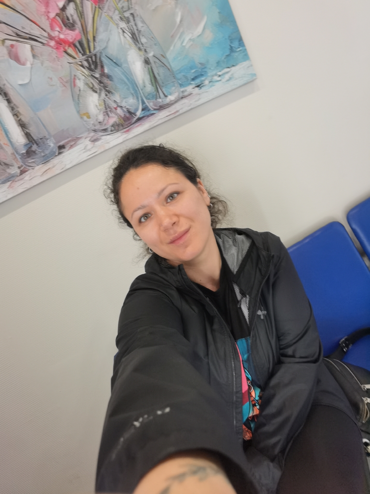 Selfies and downtime in a blue-benched waiting room