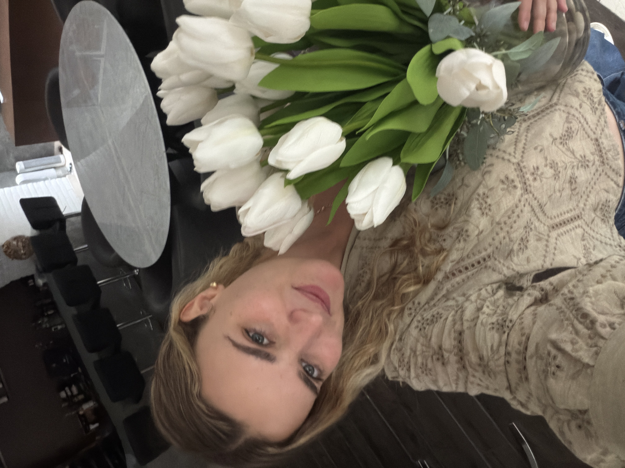 Woman poses with white tulips in Mexico photo session