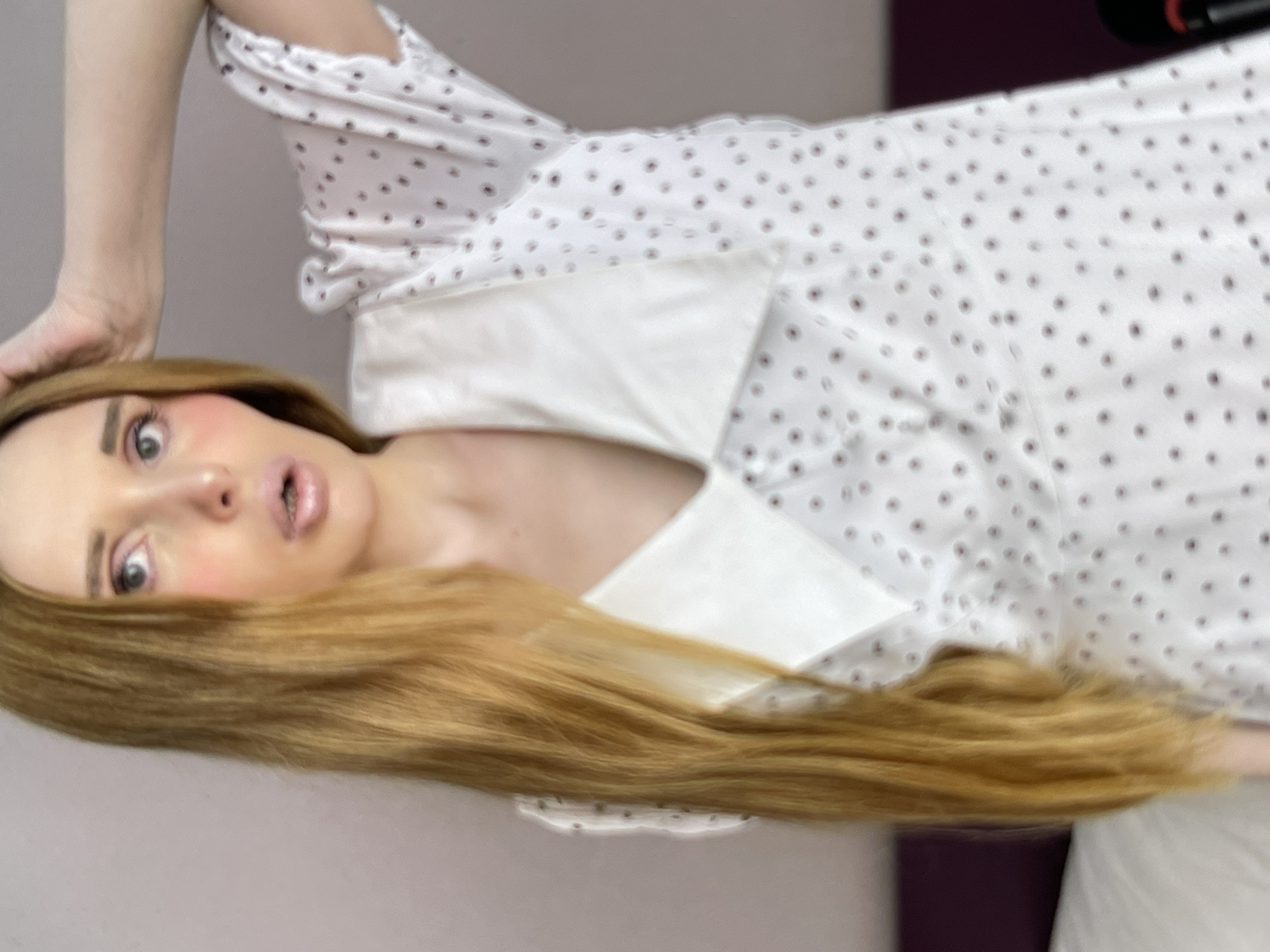 Hotel room shoot: polka dot dress, lingerie, city window backdrop.