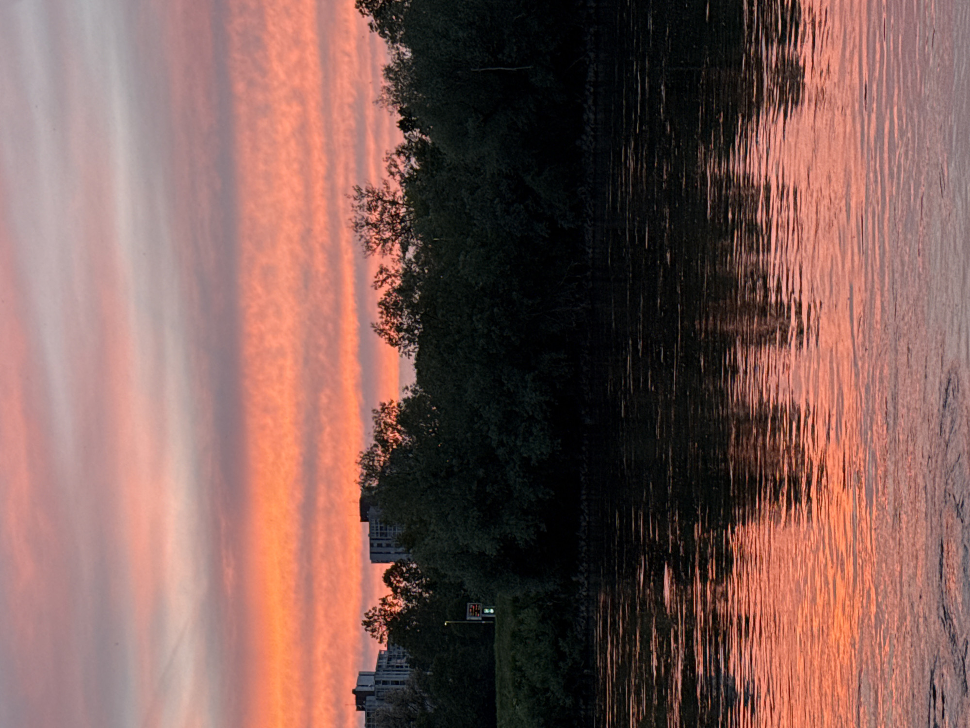 Vibrant sunset over Sava River illuminates Zagreb waterfront