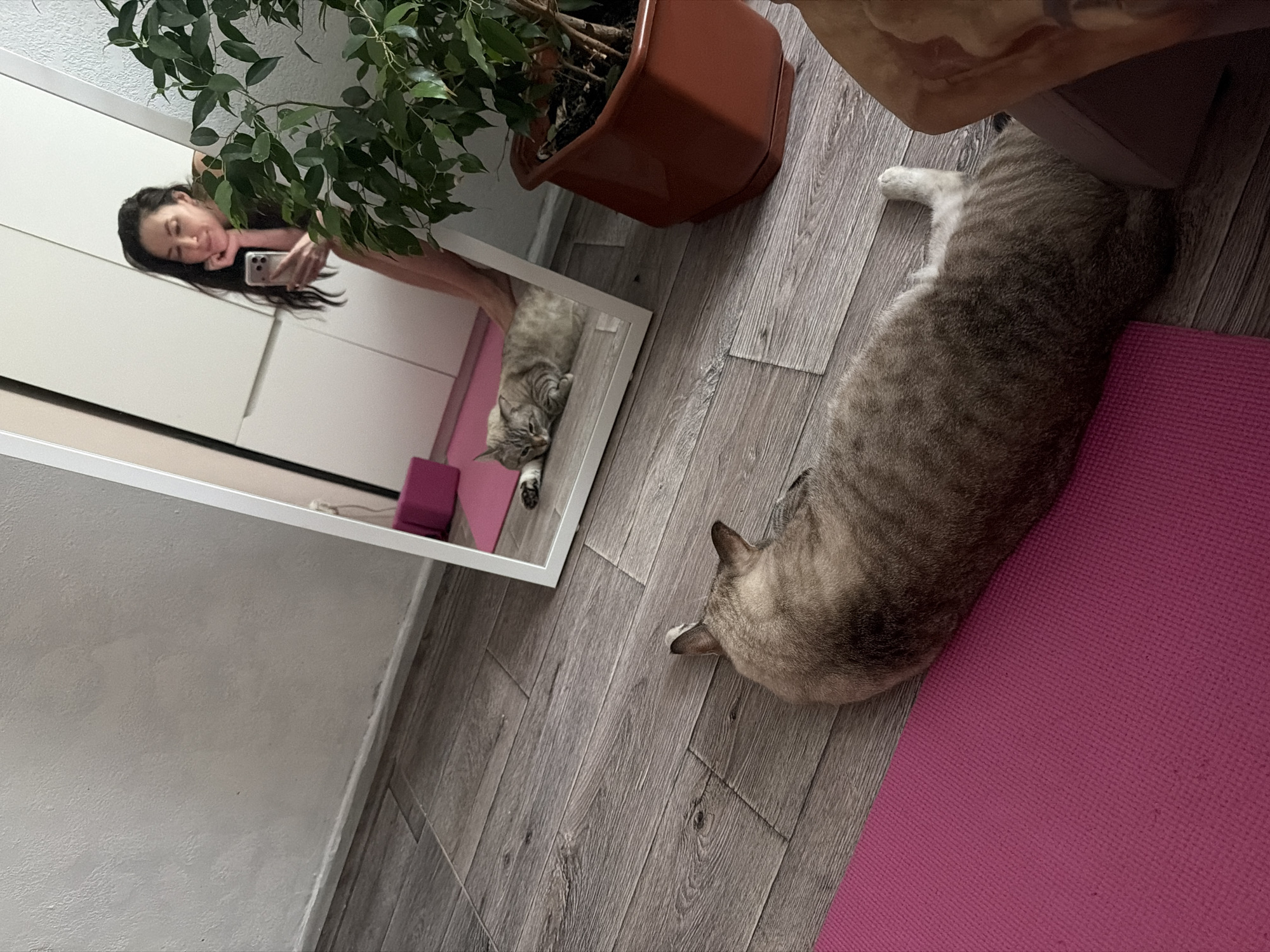 Woman in athletic wear rests indoors in Perm