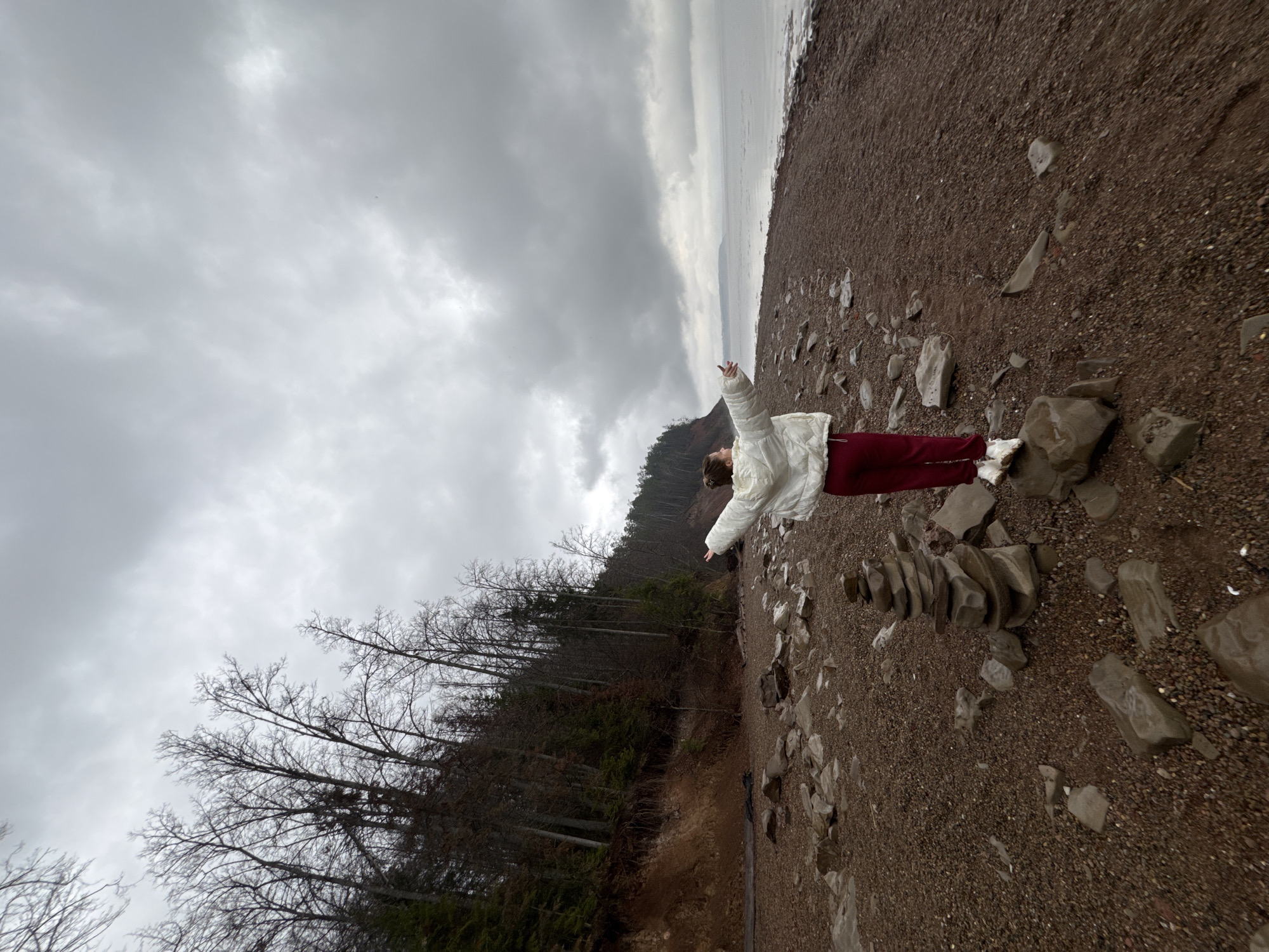 Person spotted on Russian pebble beach under overcast skies