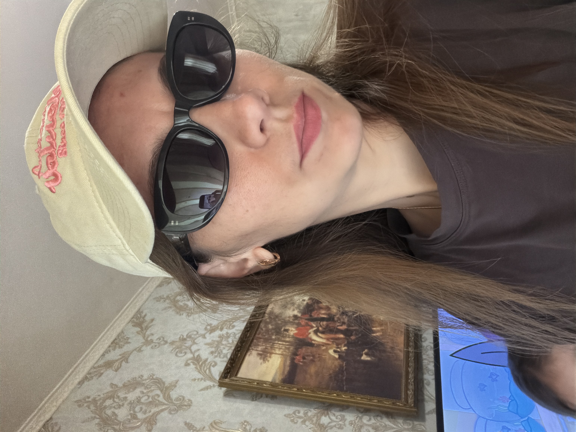Lazy summer morning indoors in Tambov, with fresh yard trimmings outside.