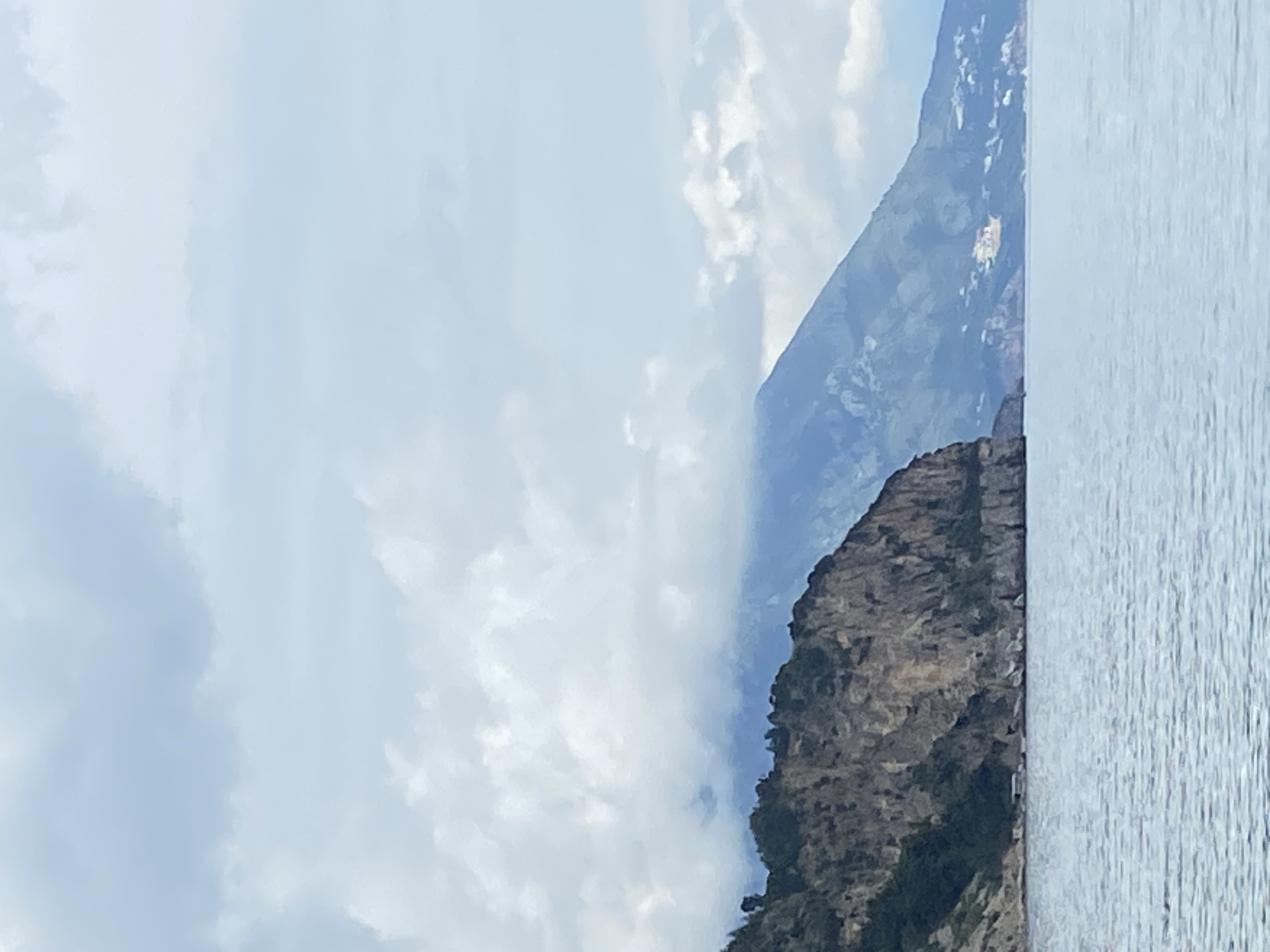 Coastal scenery documented in Prijevor, Montenegro shows cliffs and boats