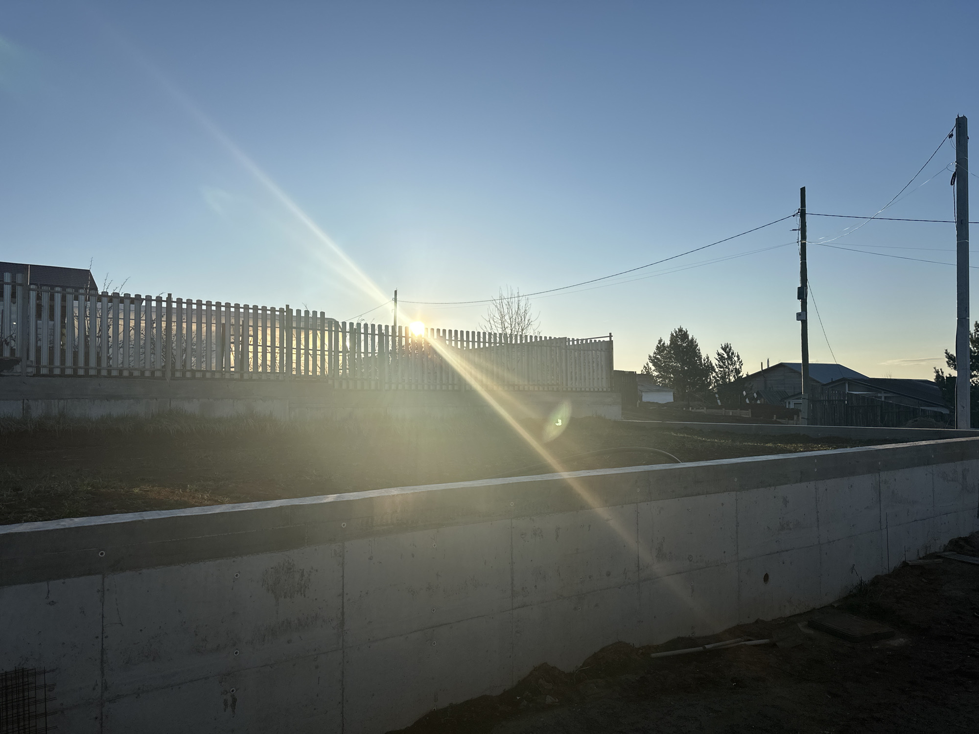 Concrete retaining wall documented under clear skies in Russia