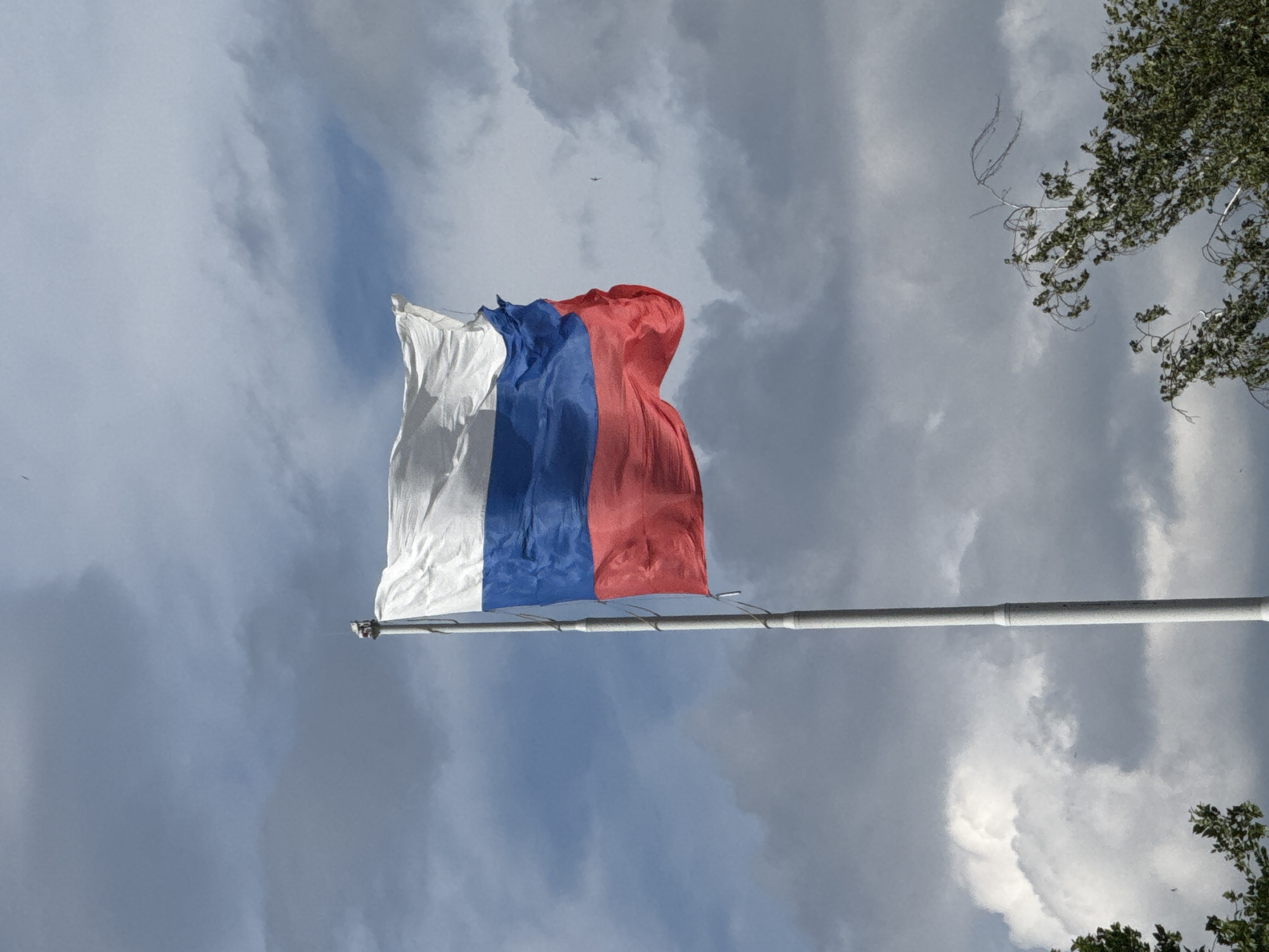 Russian flag and Orthodox church observed in unknown location