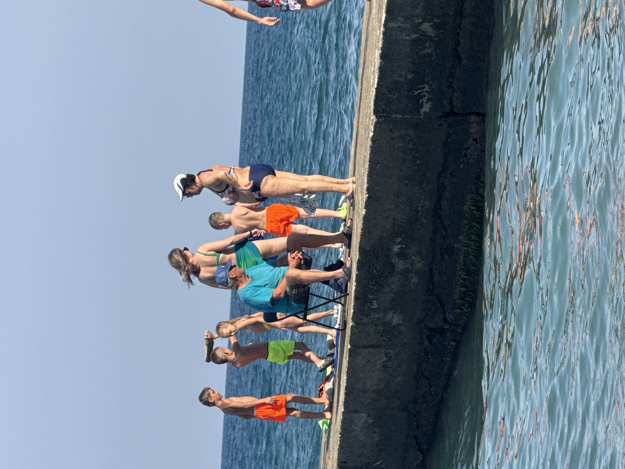 Crowded summer beach day on the Black Sea in Partenit