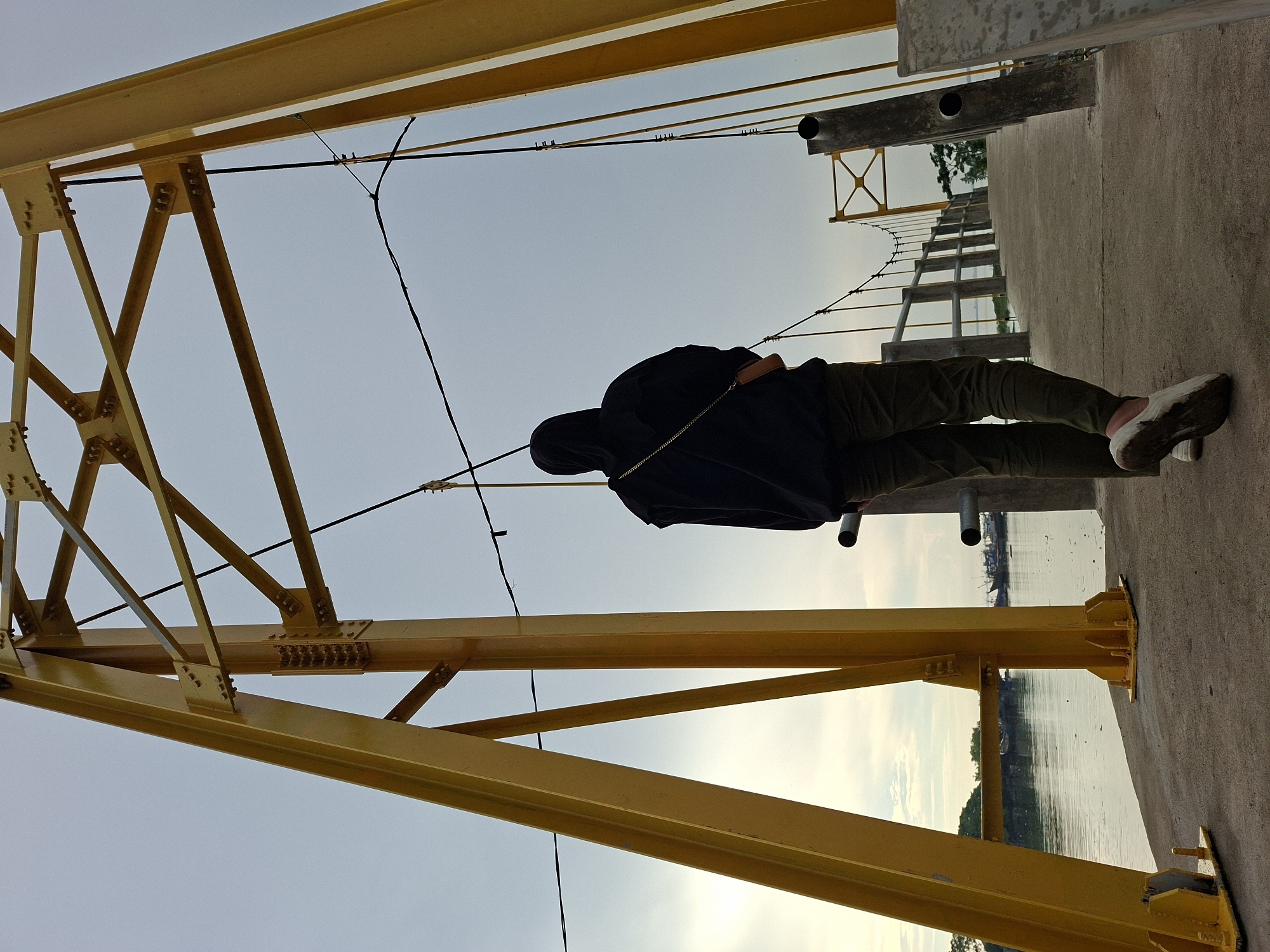 Person in black hijab visits multiple waterfront locations in Lhokseumawe