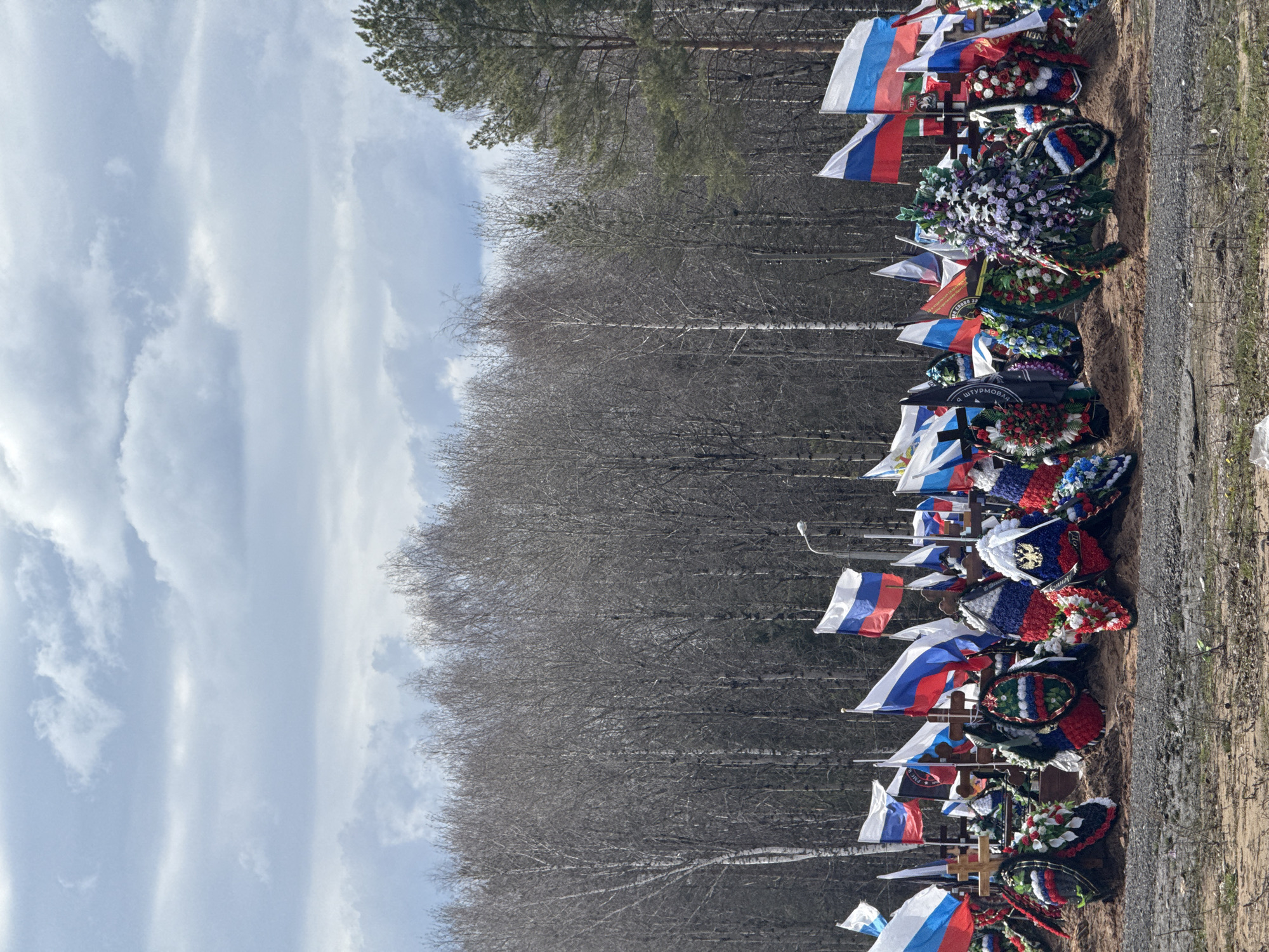 Russian flags mark graves at Perm cemetery memorial