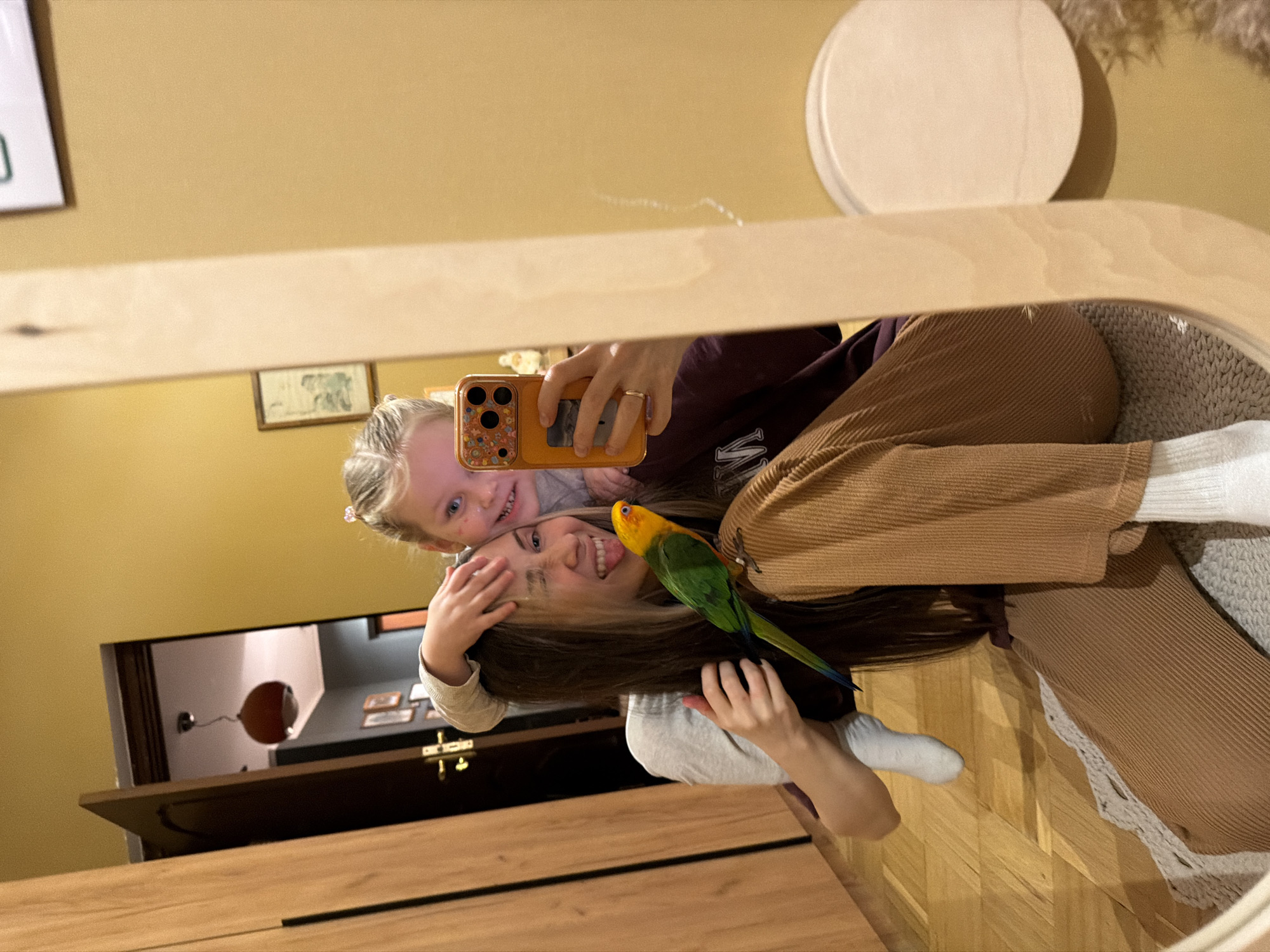 Family celebrates Easter with pet Sun Conure parrots in Khimki