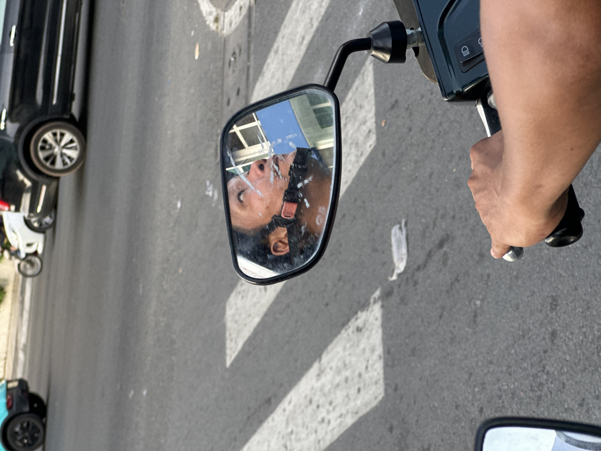 Masked motorcyclist travels through Thủ Đức streets