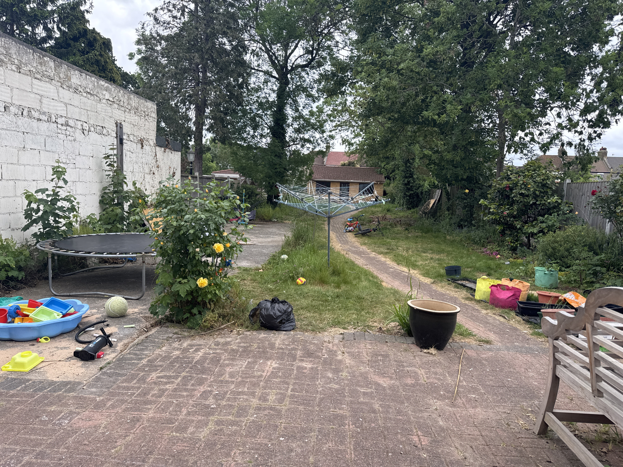 London backyard scene captured with trampoline and scattered toys