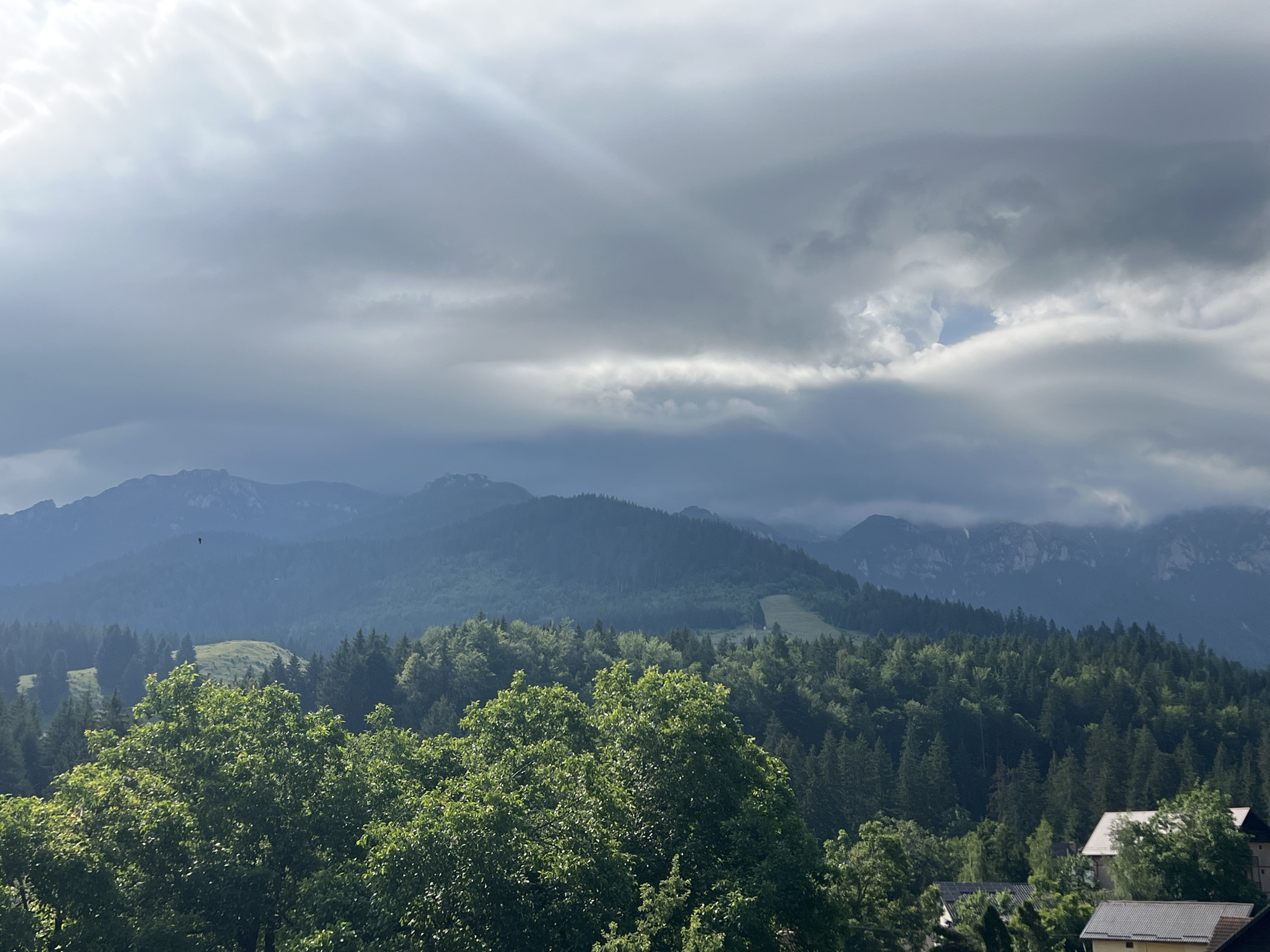 Inside and outside a rustic mountain cabin on an overcast morning