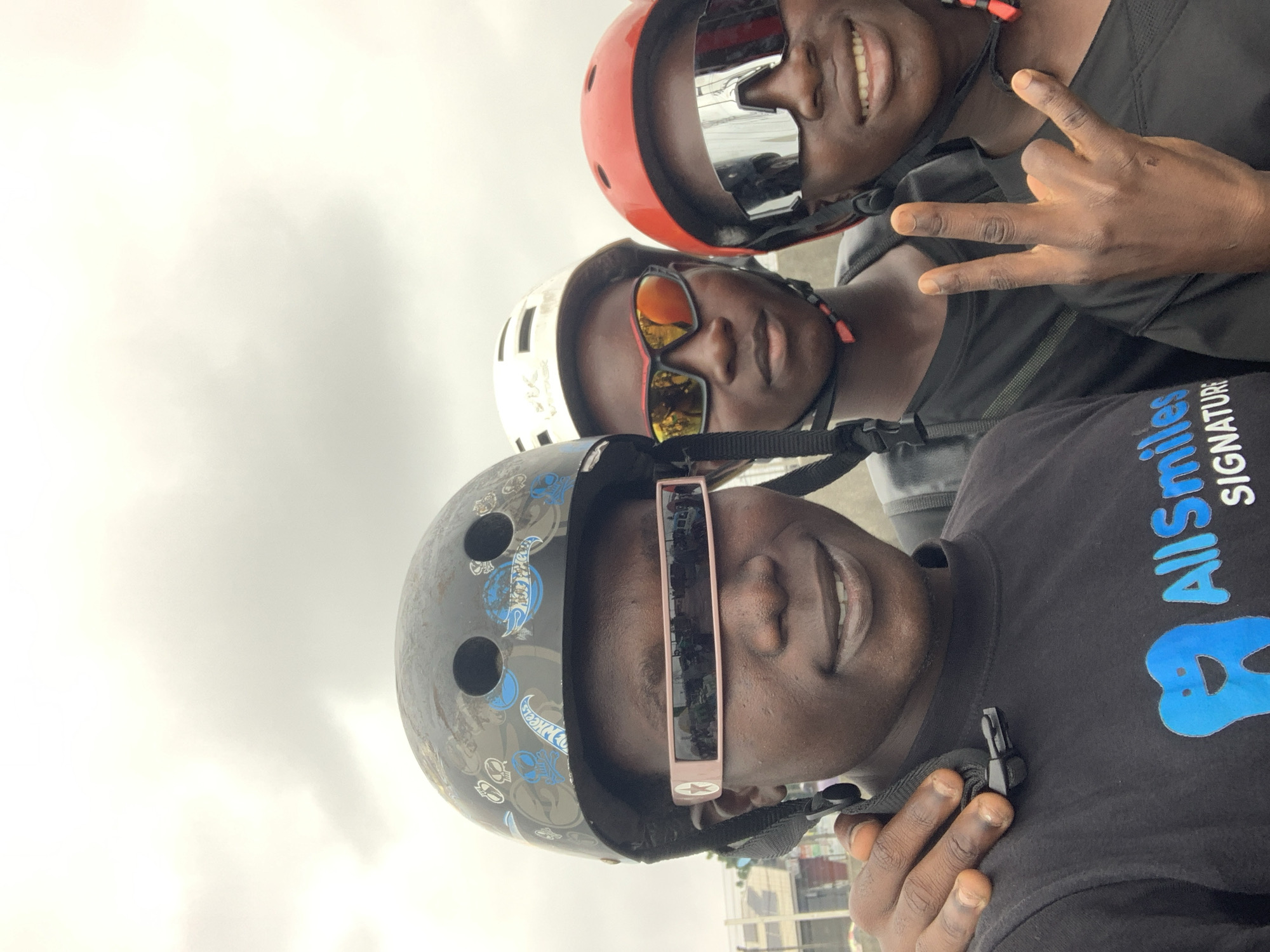 Helmeted crew snapping a roadside selfie in Lekki