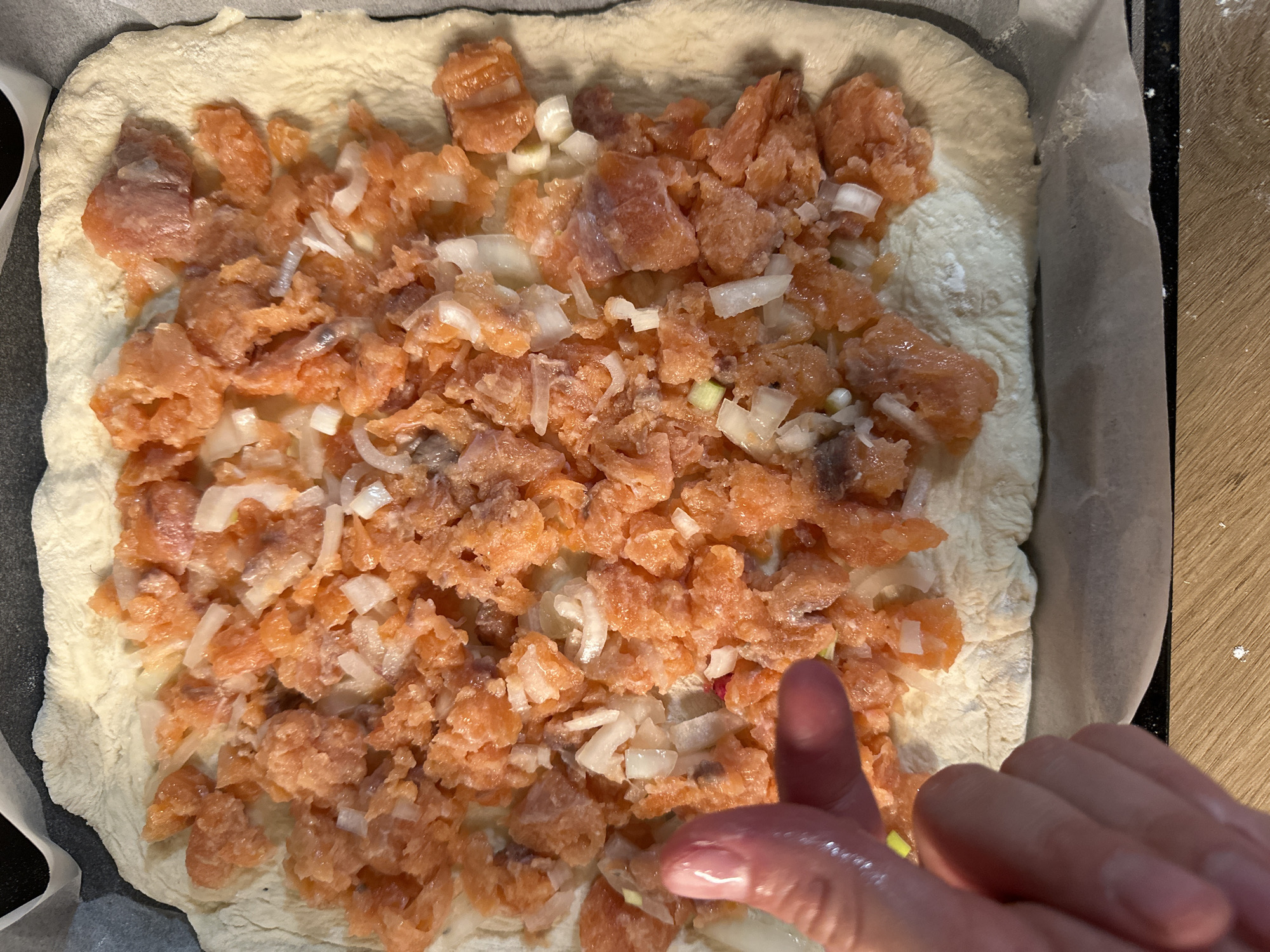 Woman prepares dough, shares meal with child in Fethiye
