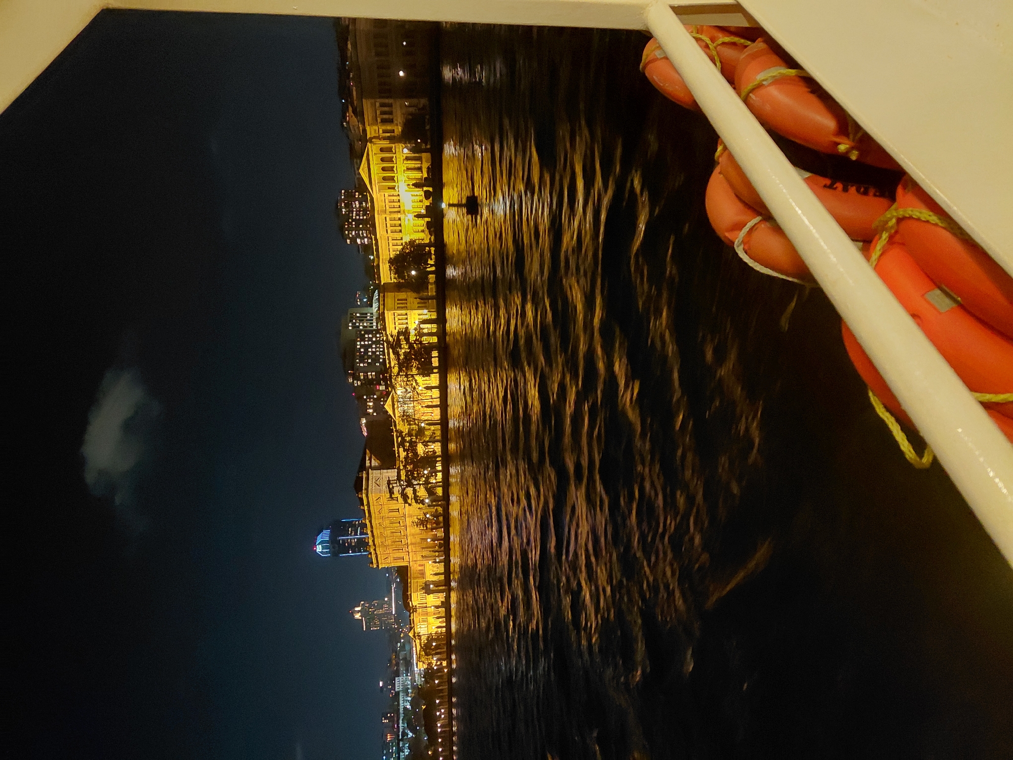 Nighttime ferry view captures illuminated Istanbul waterfront from Beşiktaş