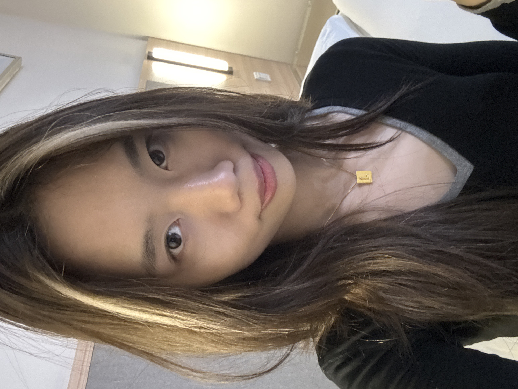 Woman takes selfies in Chongqing hotel room