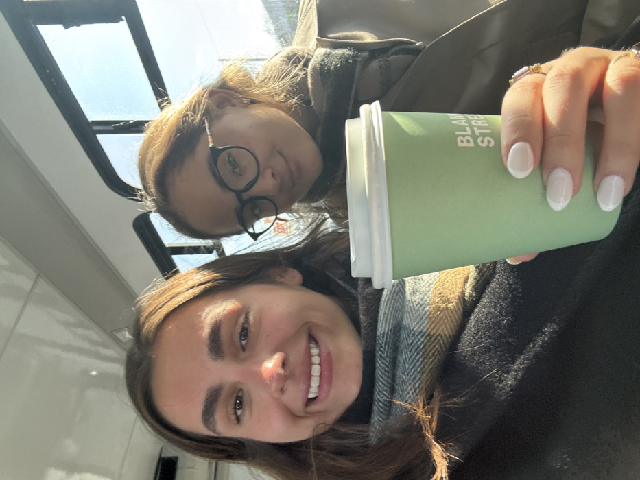 Two women take selfie on public transit in Belmont