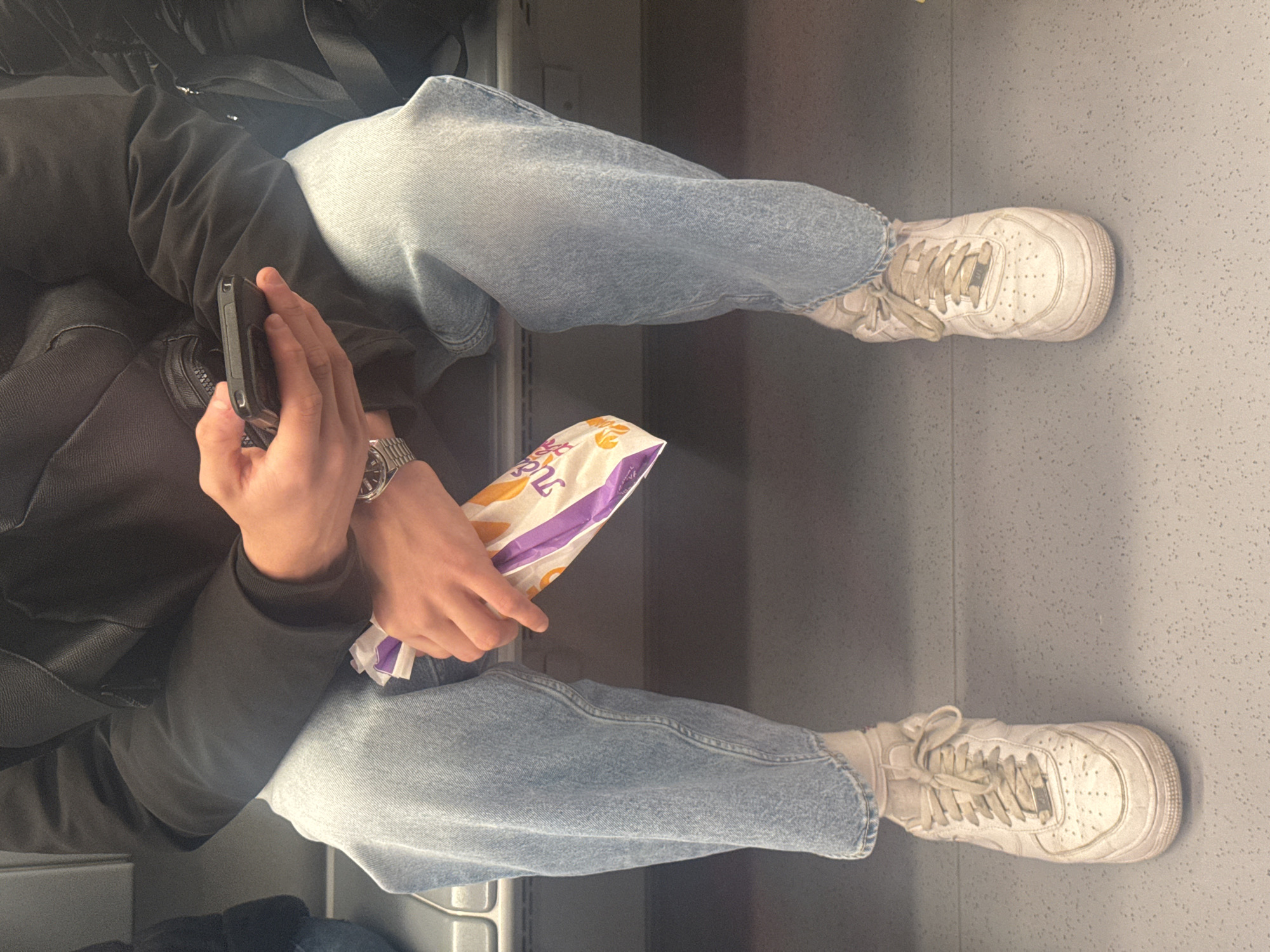 Morning commuter uses public transport with earphones in Sofia