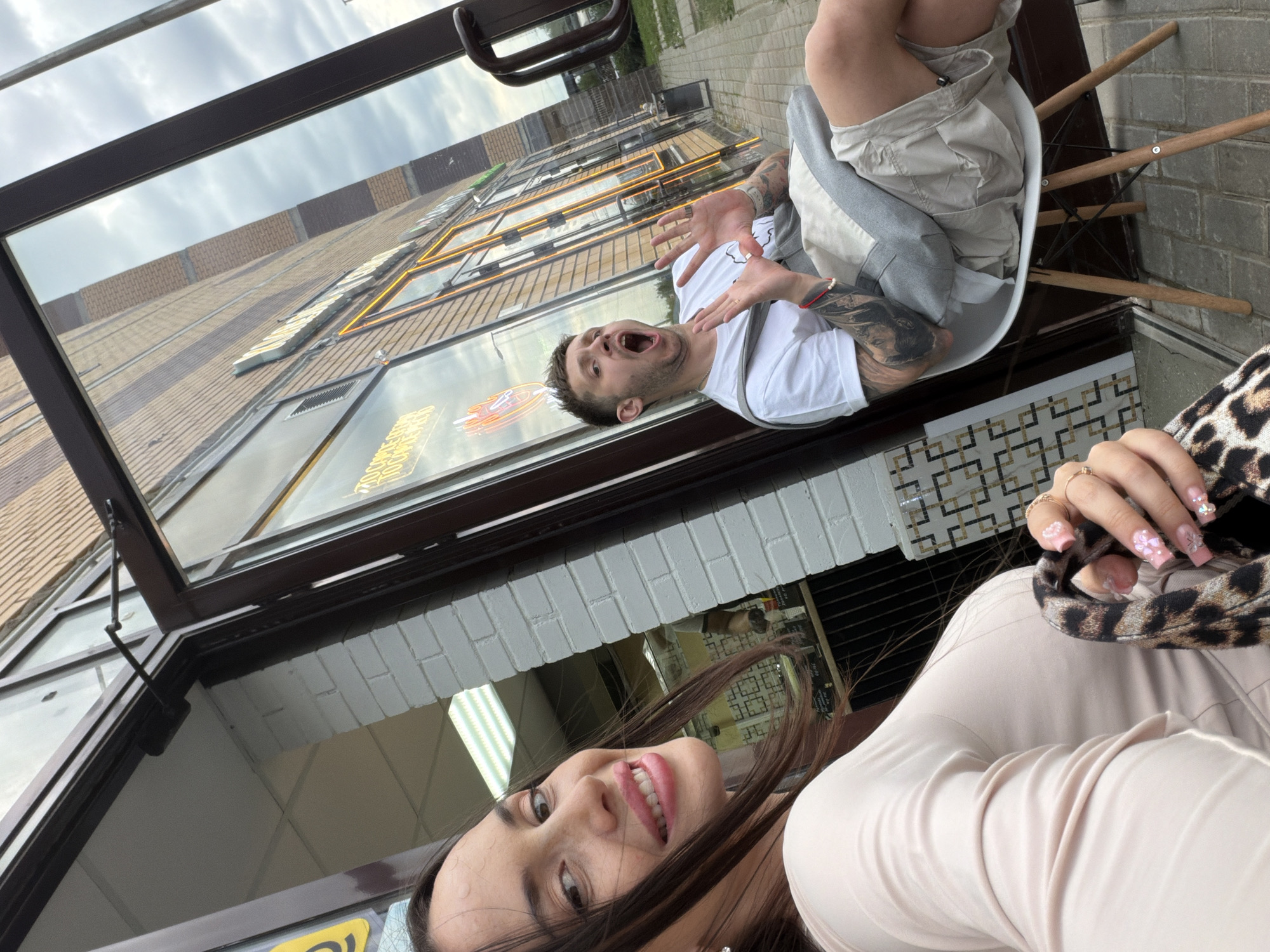 Woman takes selfies outside Saint Petersburg vapor shop