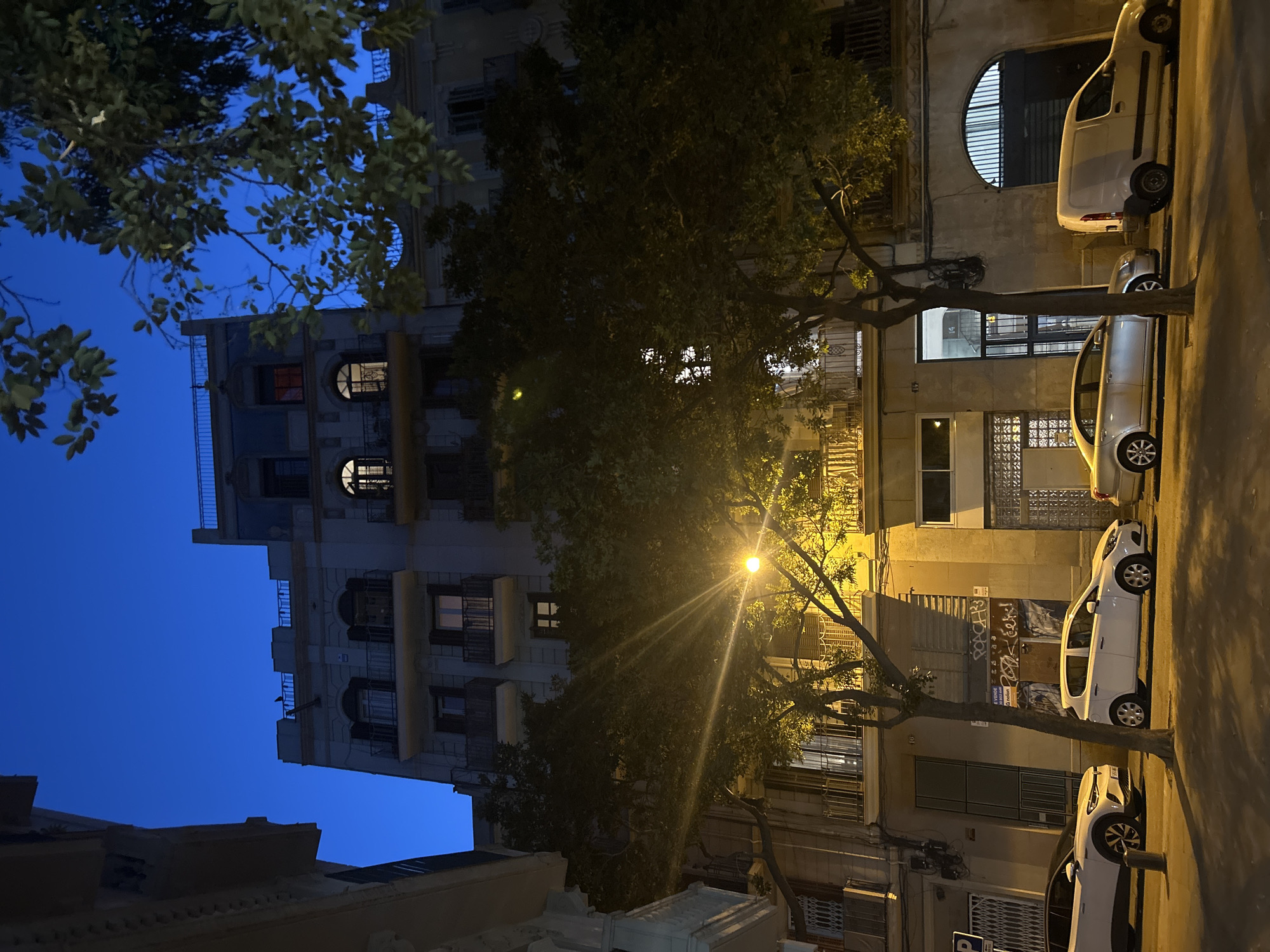 Acteco delivery truck on a Barcelona street at dusk