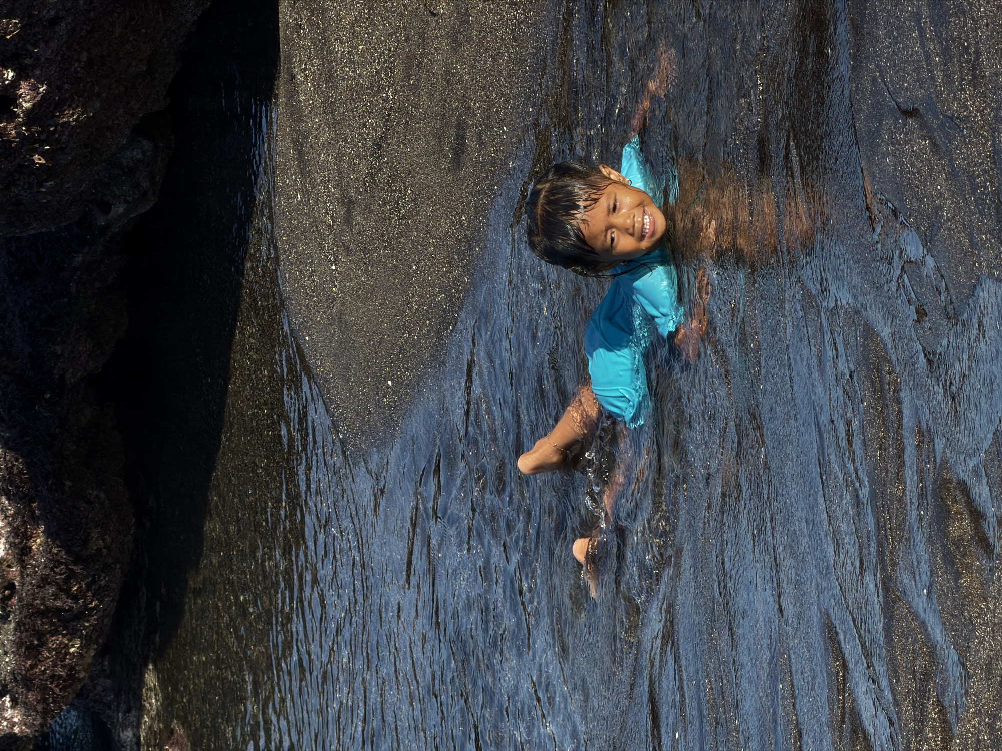 Morning beach activities on Mengwi's black sand shores