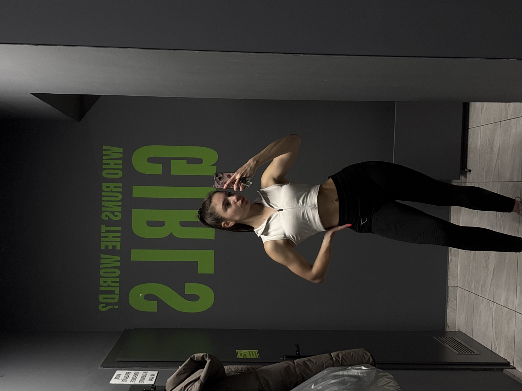Woman takes workout selfies at gym facility