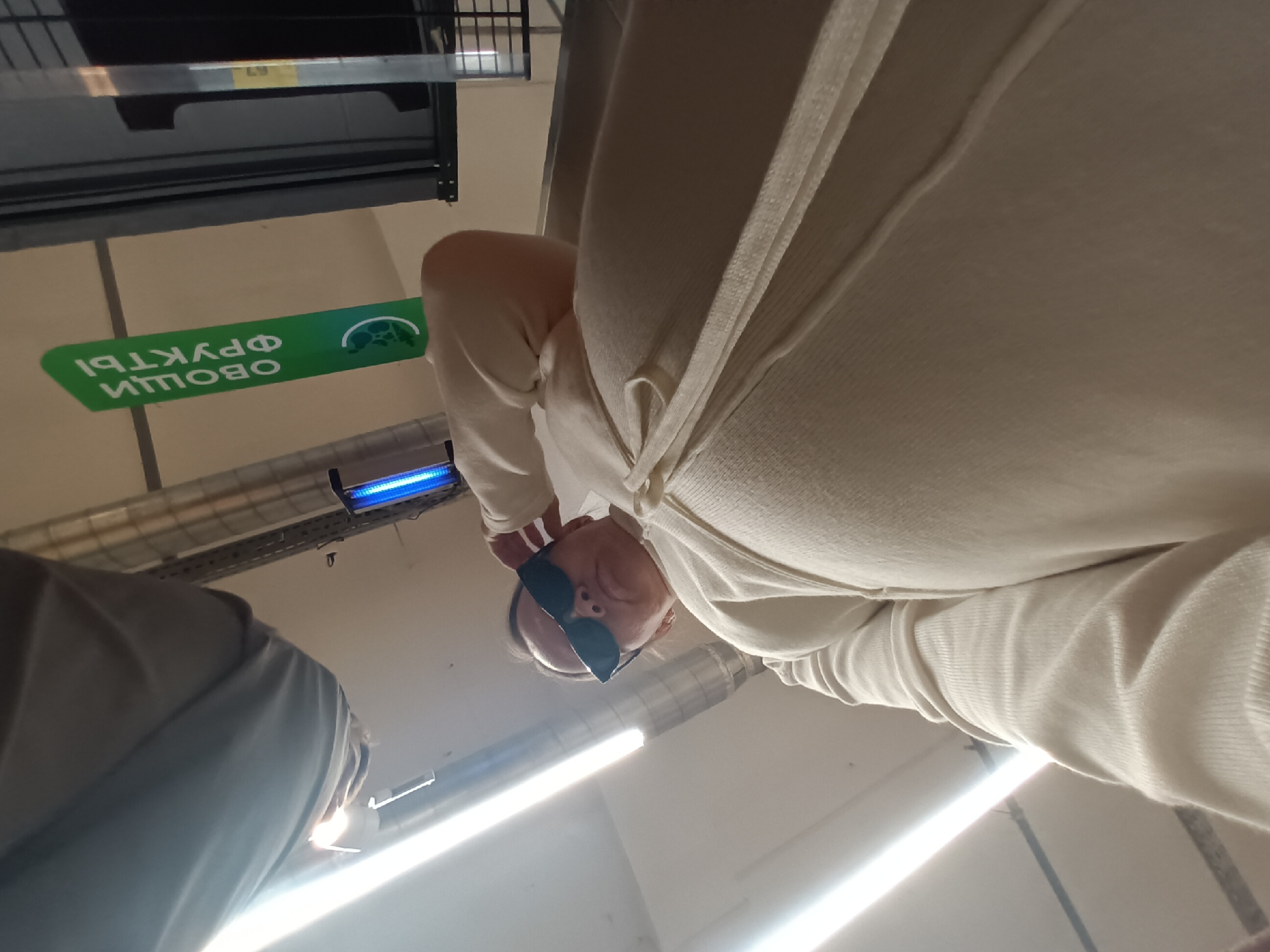 Shoppers photographed in Chaikovsky grocery store produce section