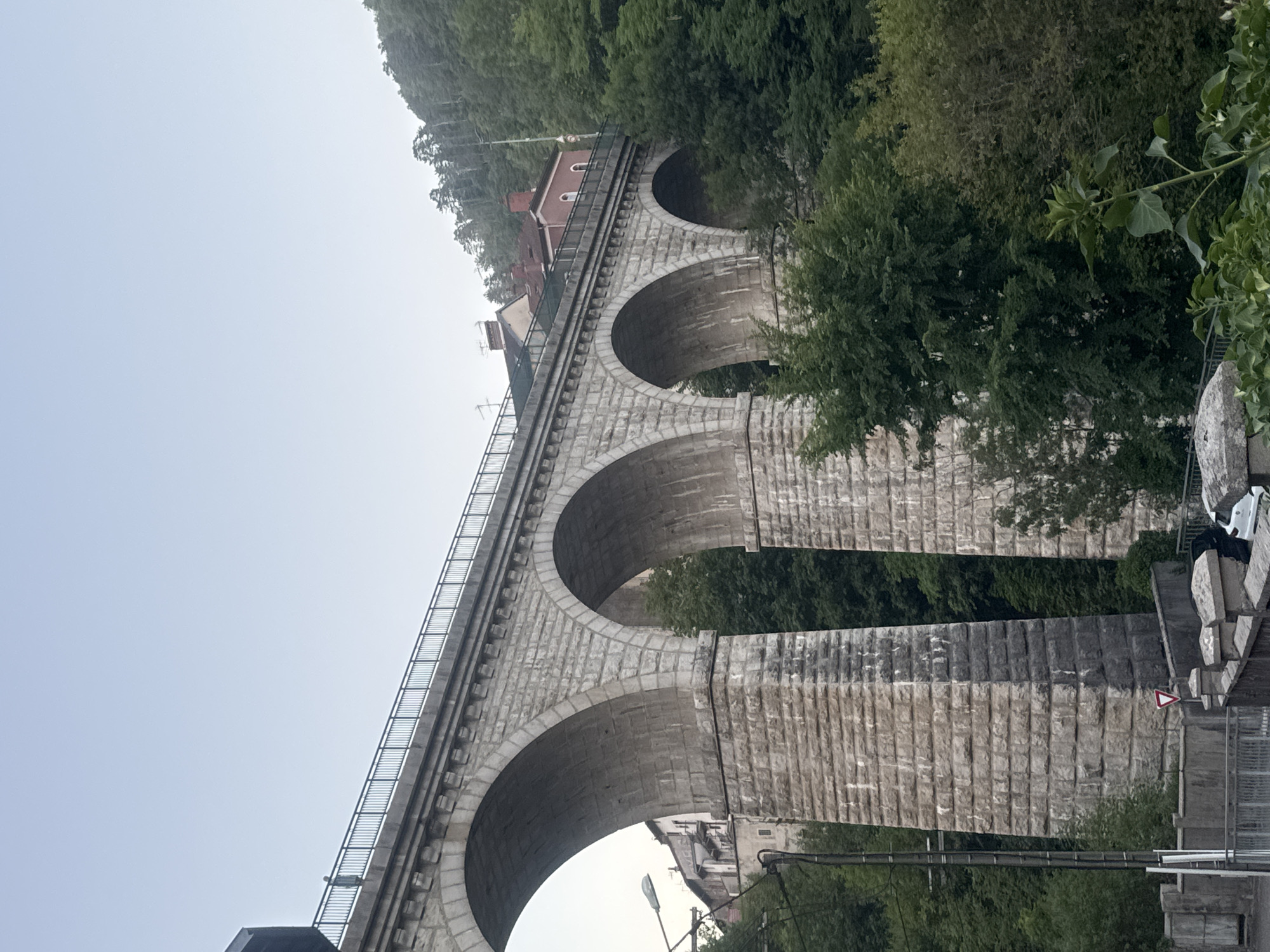 Saint-Claude's historic stone viaduct, buildings perched on top