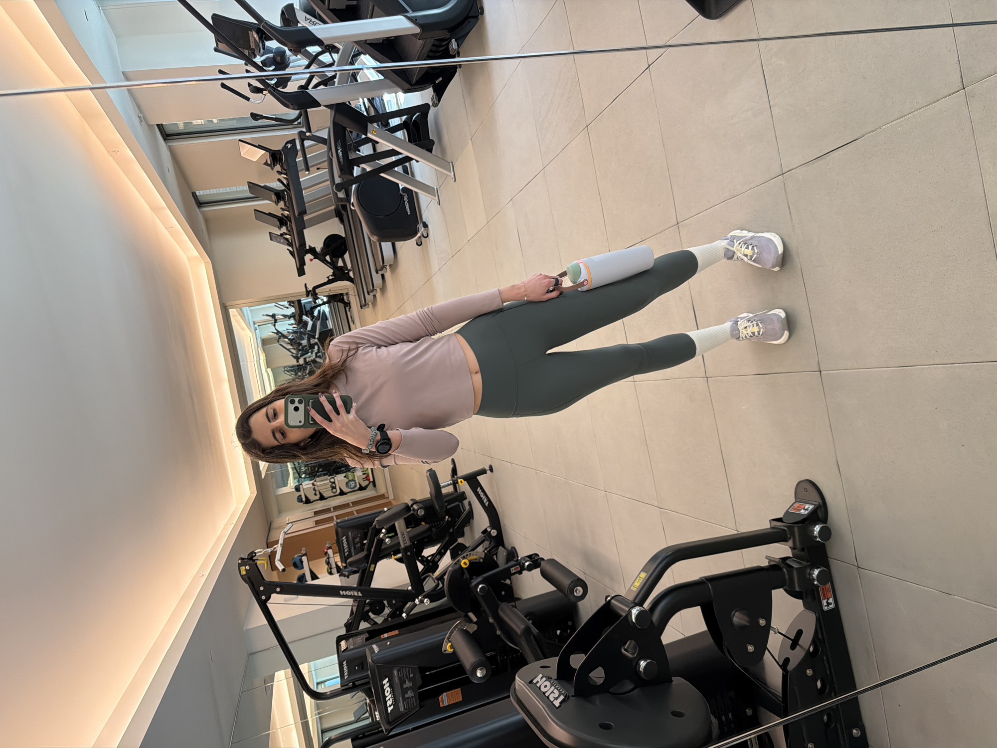 Woman takes selfie at New York gym