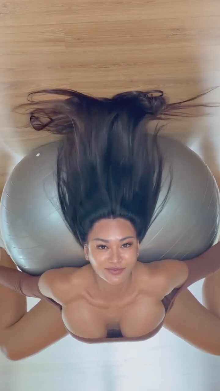 Stability ball stretch on a wooden floor in Moscow