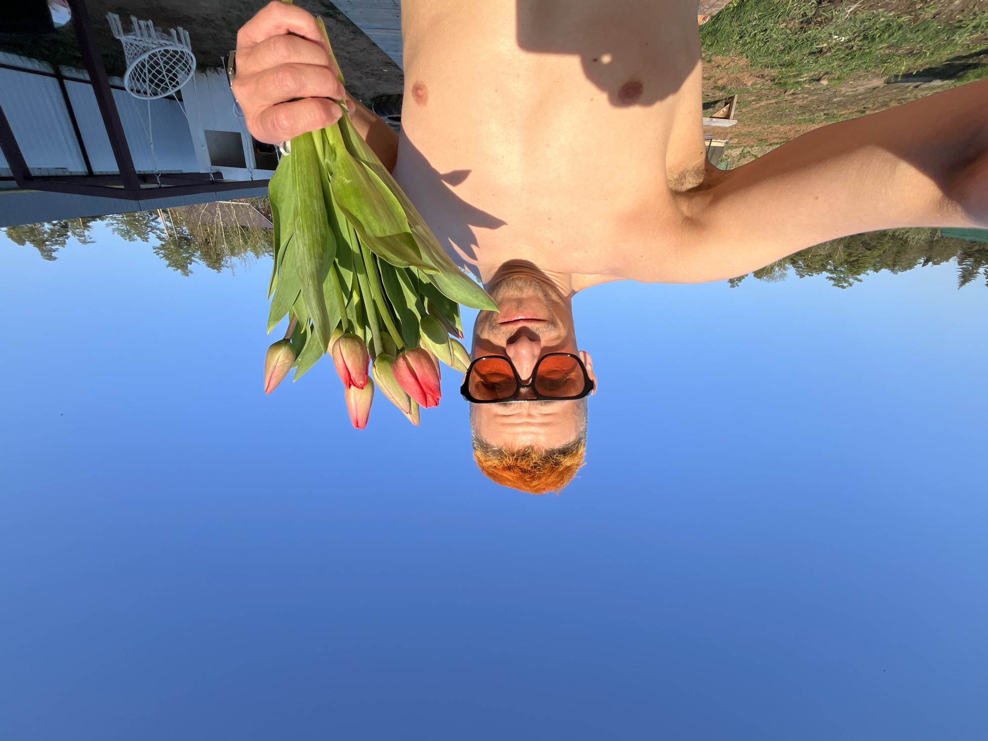 Orange-haired man spotted with tulips, drink in Chaikovsky