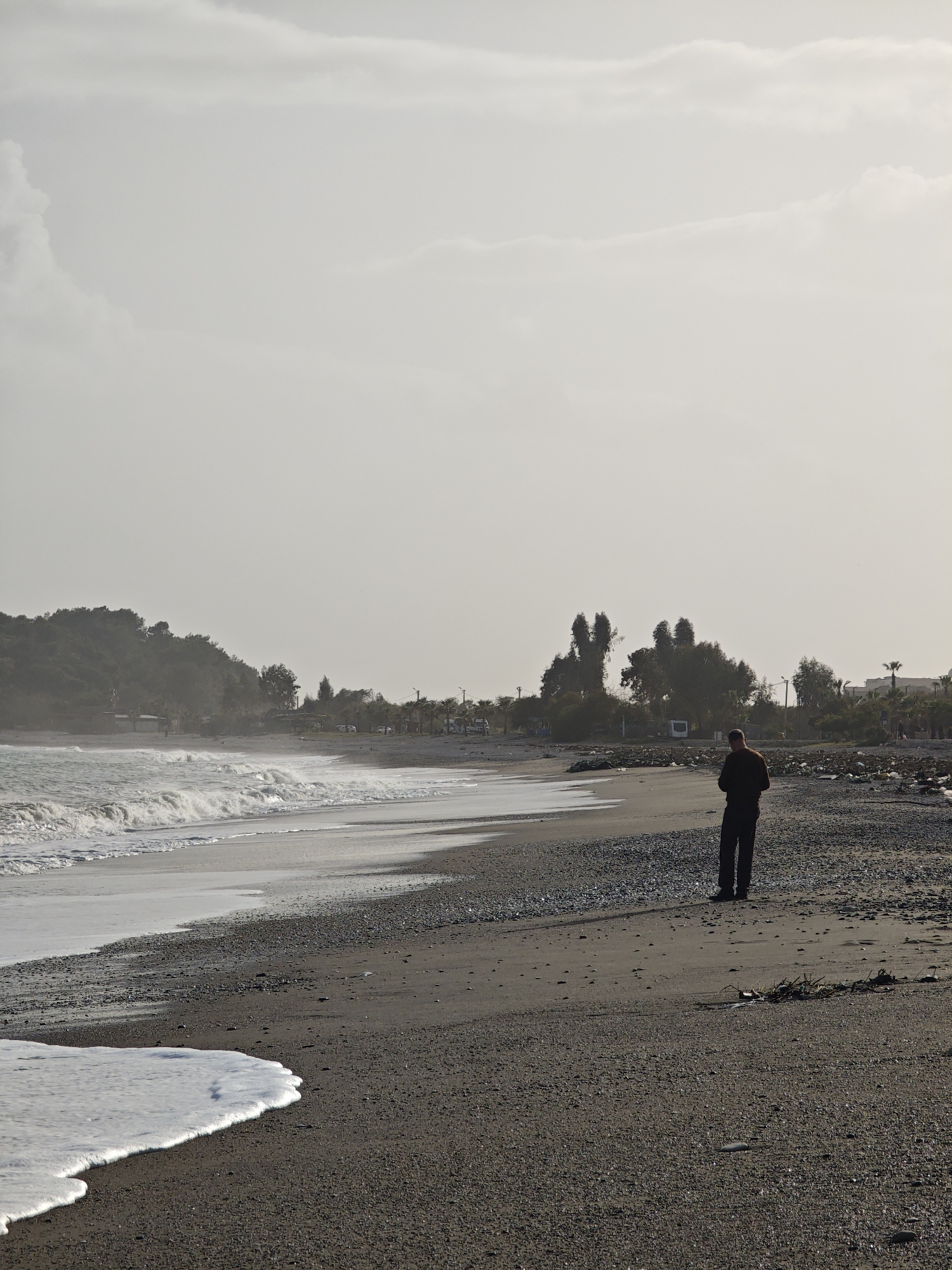 Lone visitor watches waves break on Demre beach