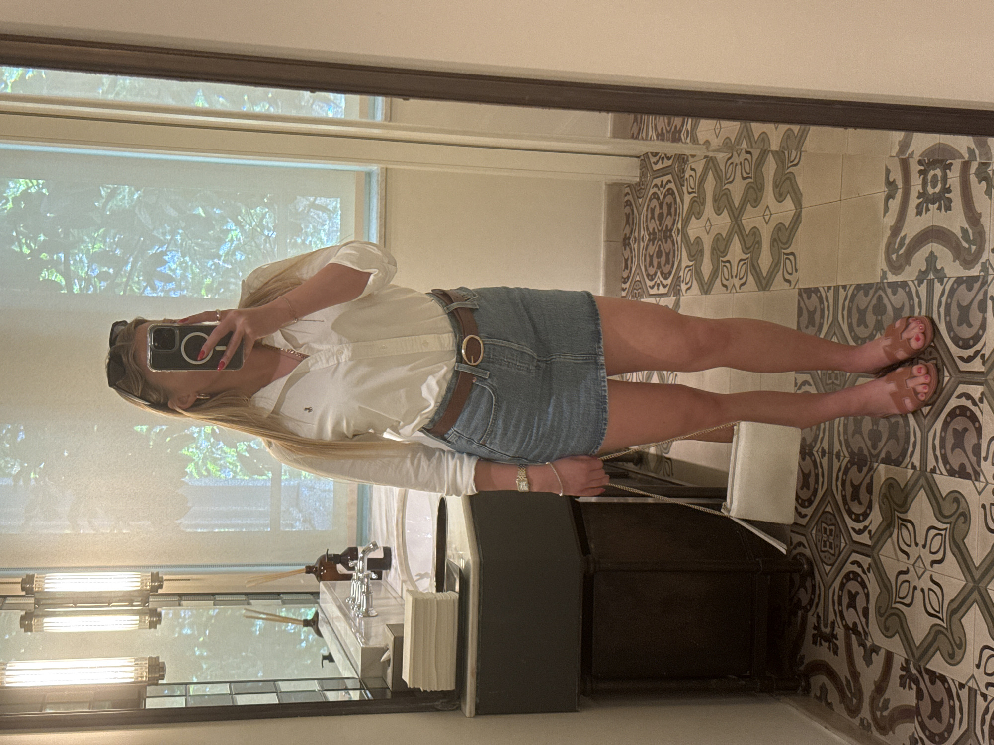 Woman Takes Selfies in Dressing Room During Morning Shopping