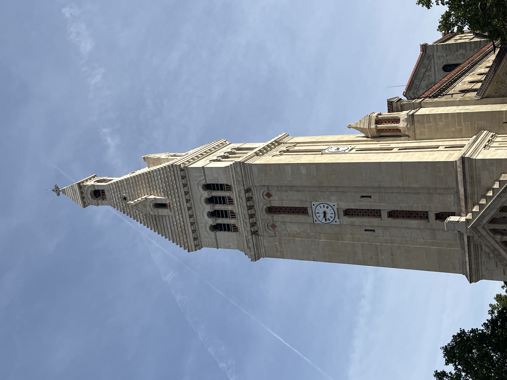 Church towers and Parisian streetscapes on a clear July morning