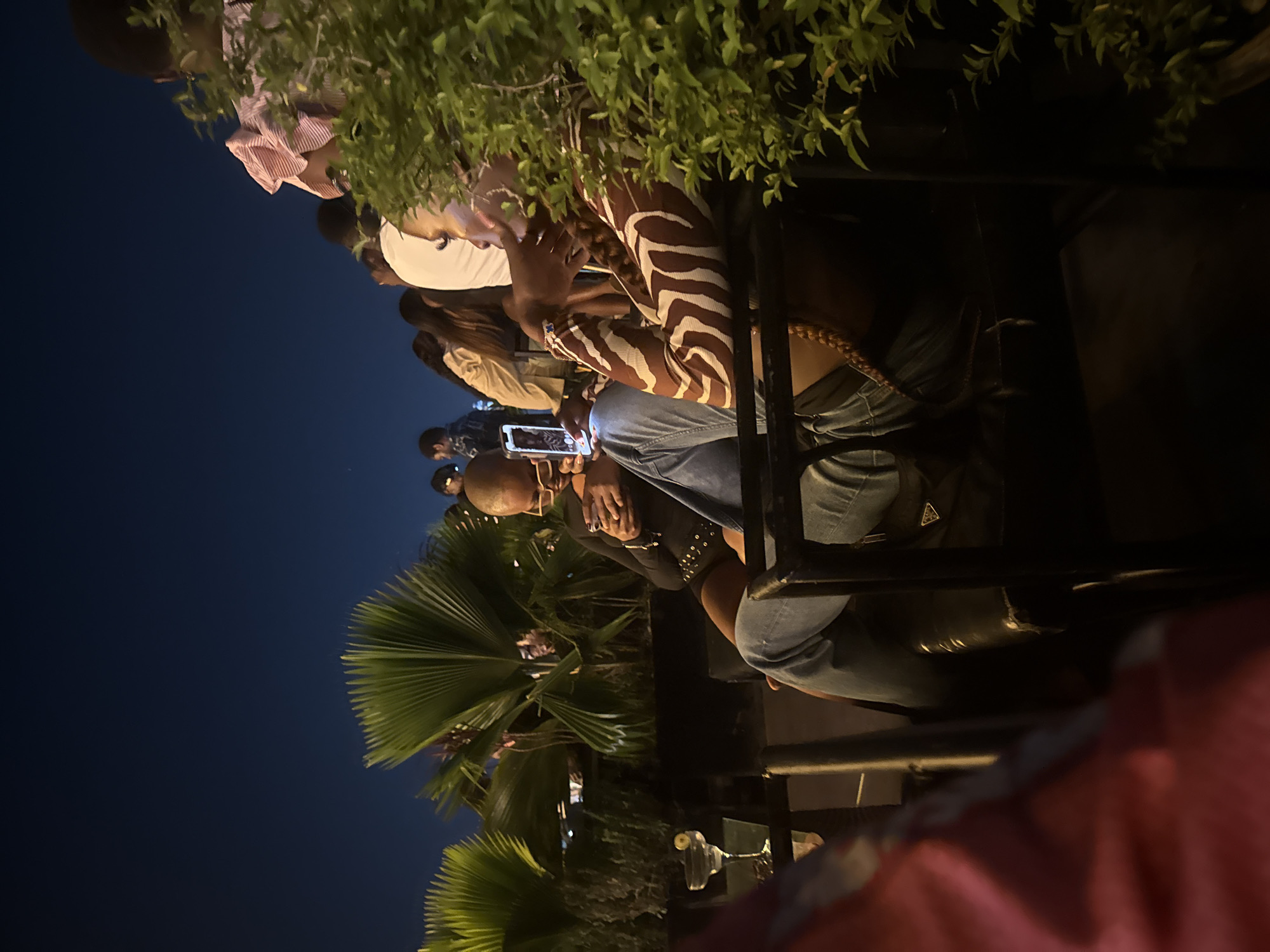 Evening outdoor gathering documented in Ado, Nigeria