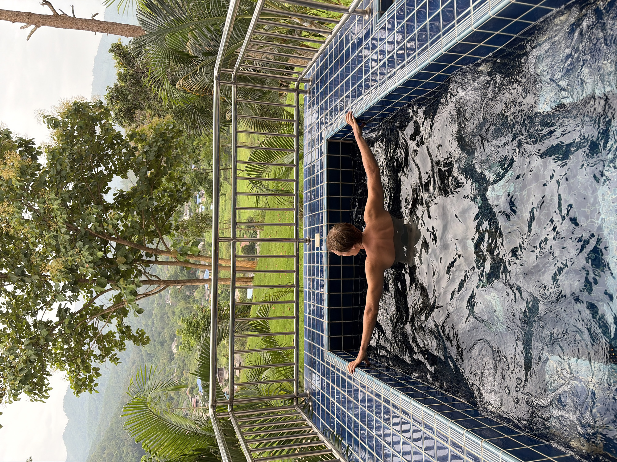 Yoga and hot tub time on a scenic balcony in northern Thailand