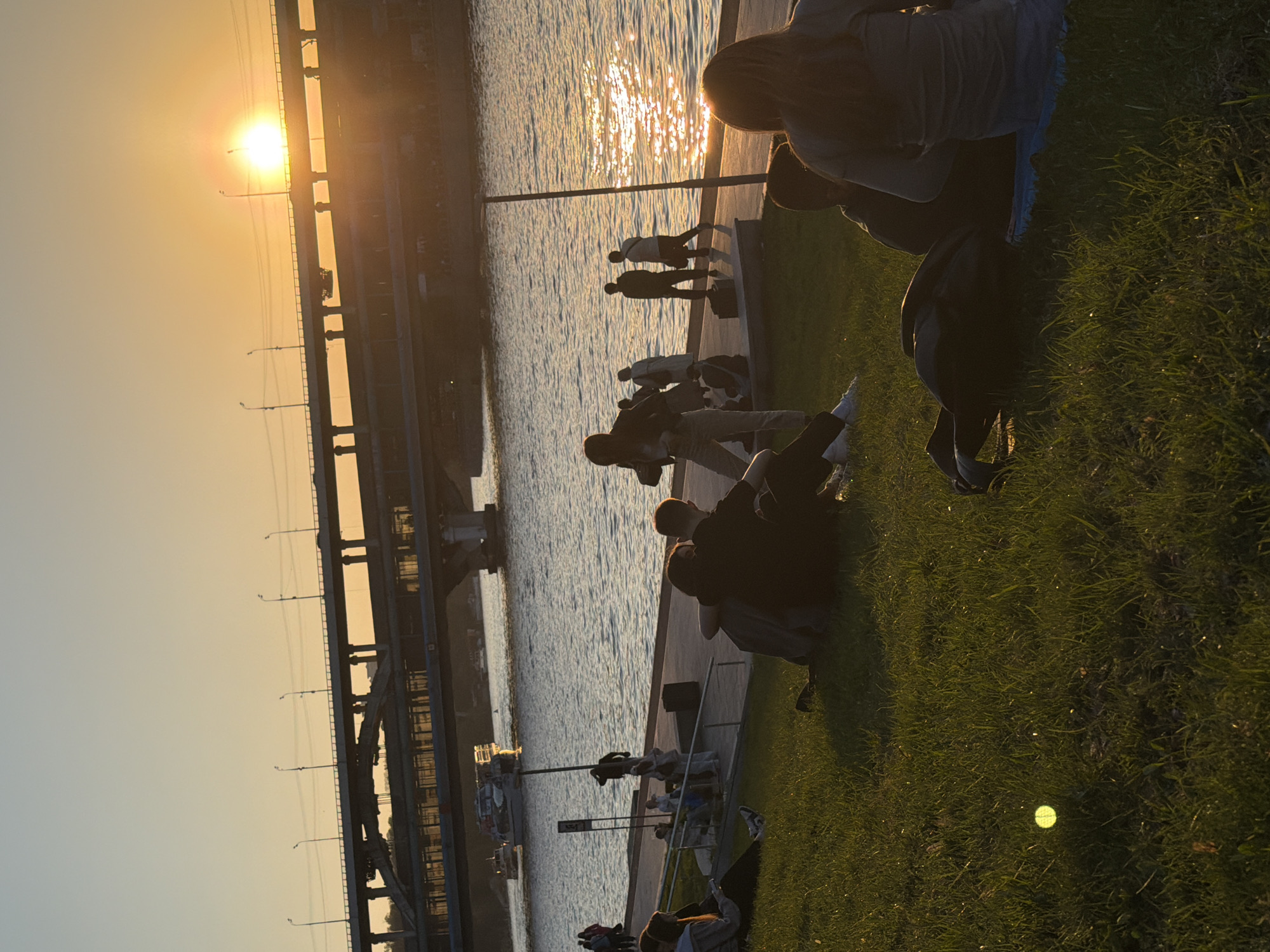 Evening riverside gathering in Moscow draws residents during golden hour