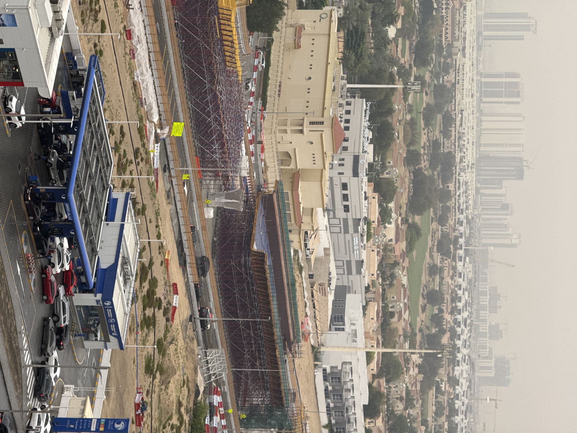 Aerial view shows Dubai gas station with parked cars